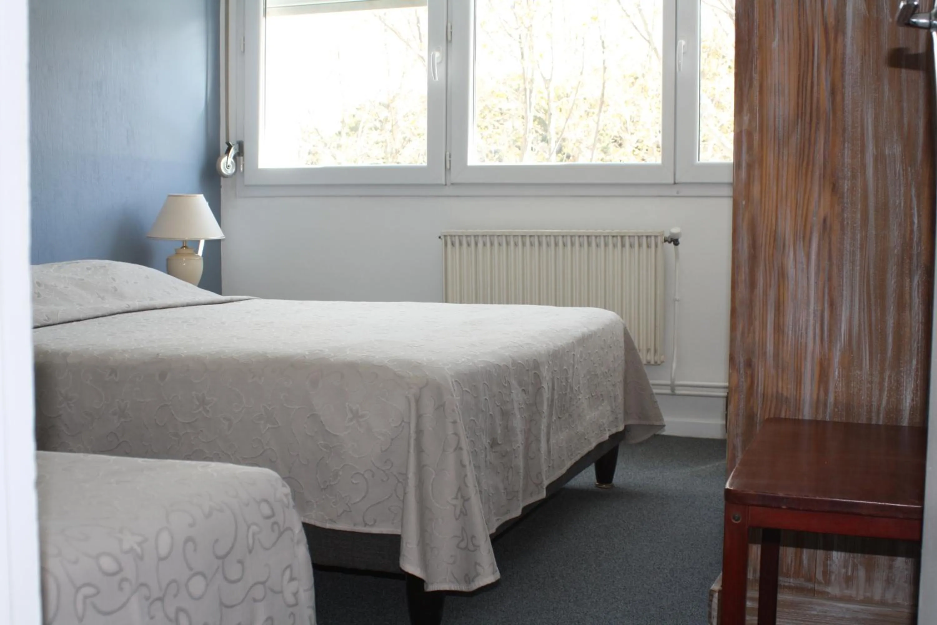 Bed in Logis Hotel du Midi