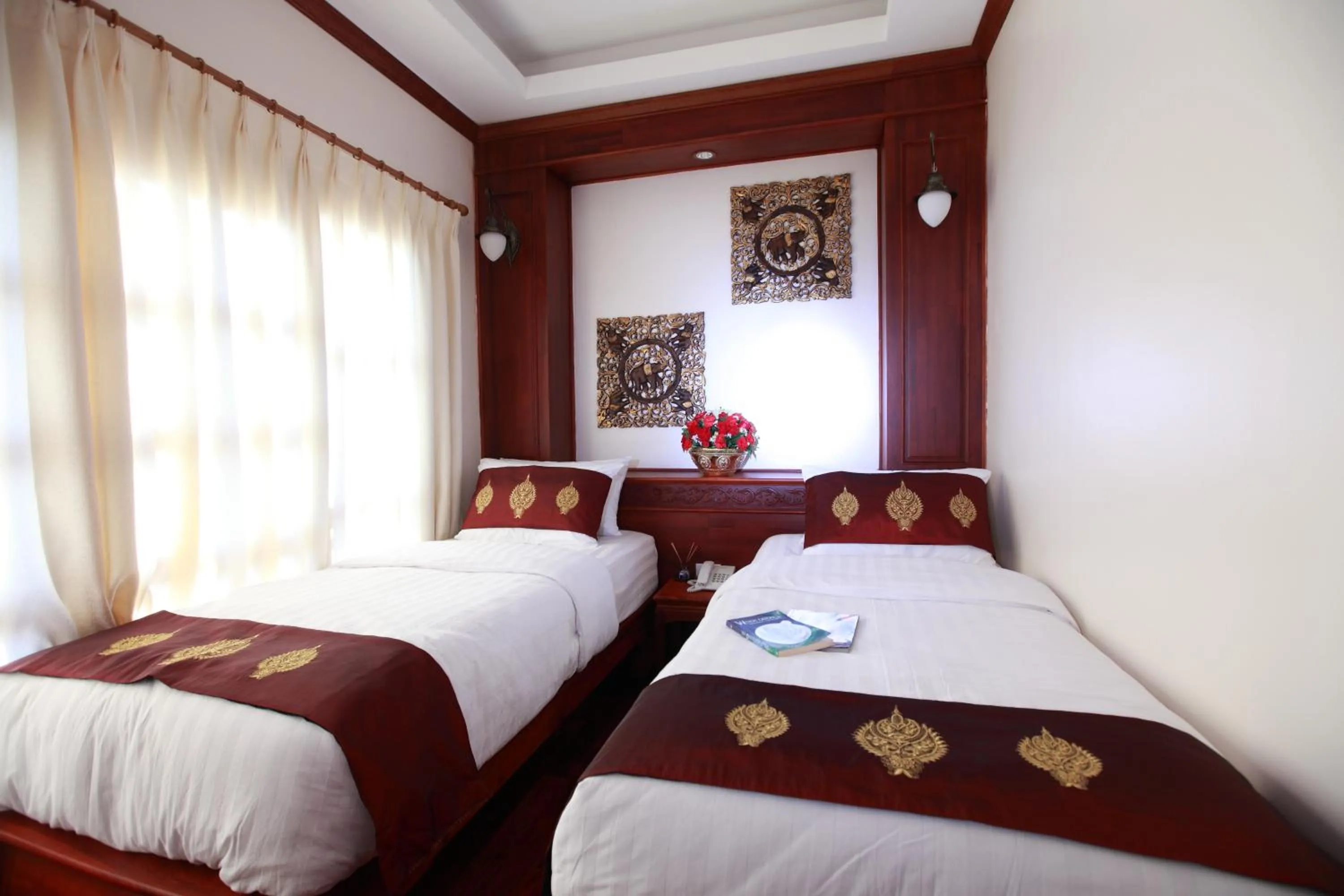 Bed in Manorom Boutique Hotel