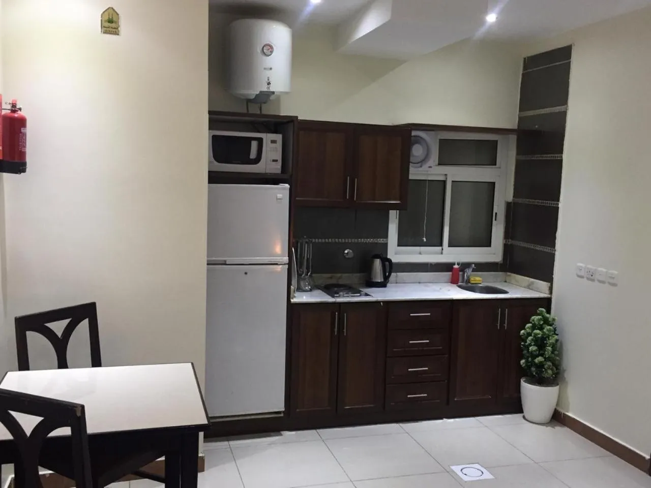 Kitchen or kitchenette in Merfal Hotel Apartments Al Taawan
