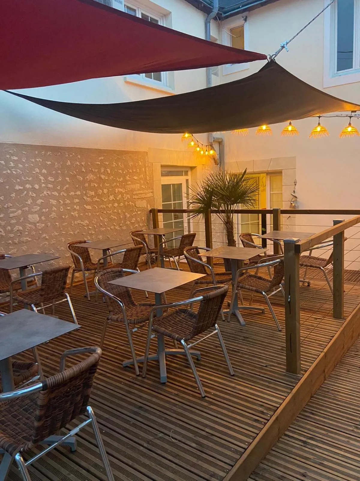 Patio in Logis Hôtel Restaurant L'Odyssée Champêtre