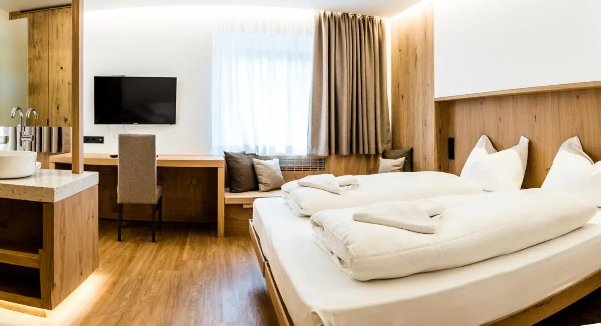 Bed in Hotel Des Alpes