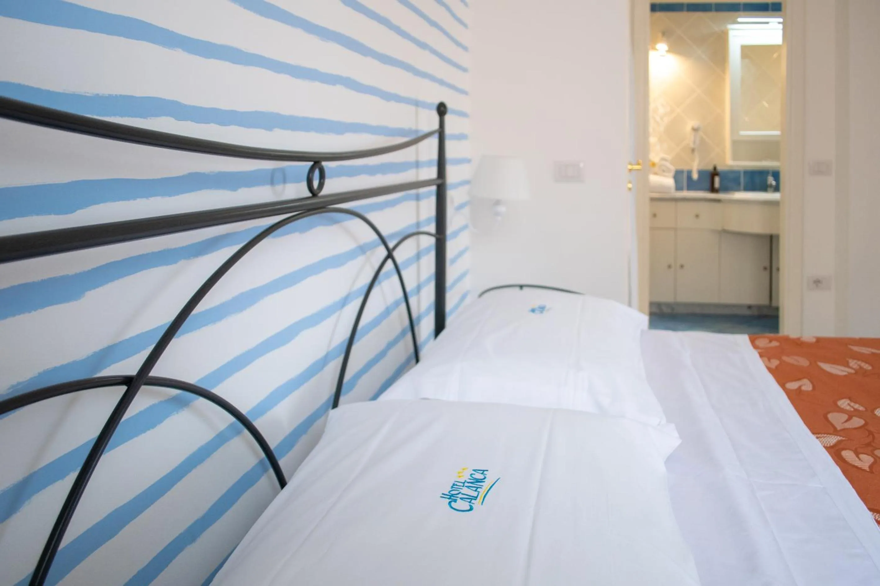 Bed in Hotel Calanca