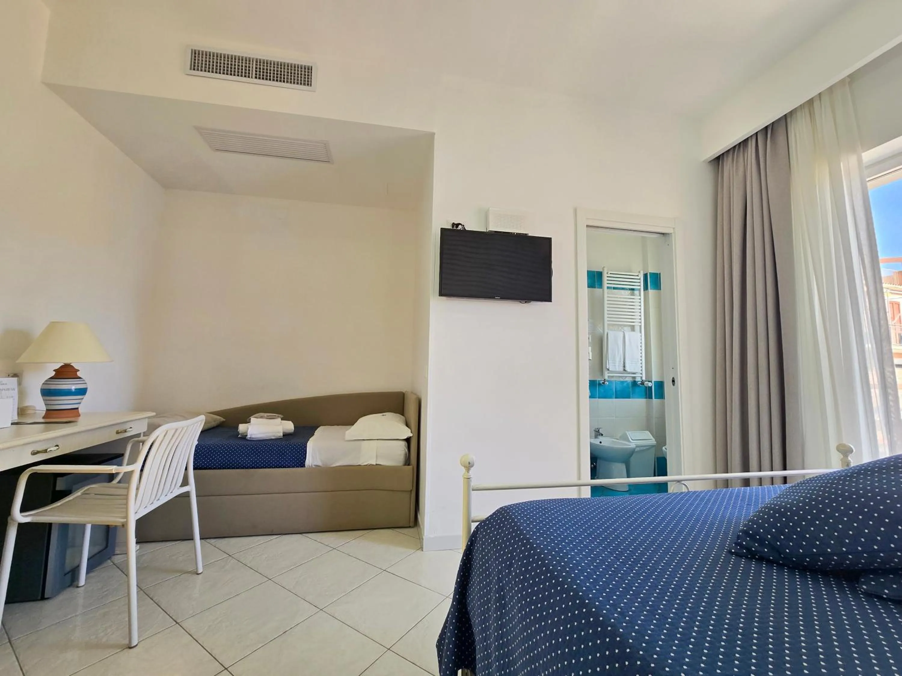 Bed in Hotel Calanca