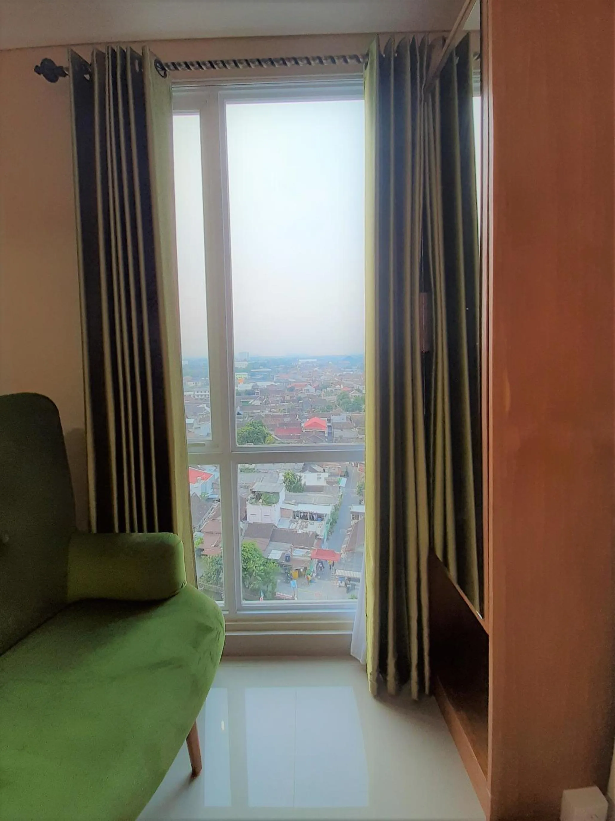 Living room in Apartemen Taman Melati Sinduadi By NGINAP