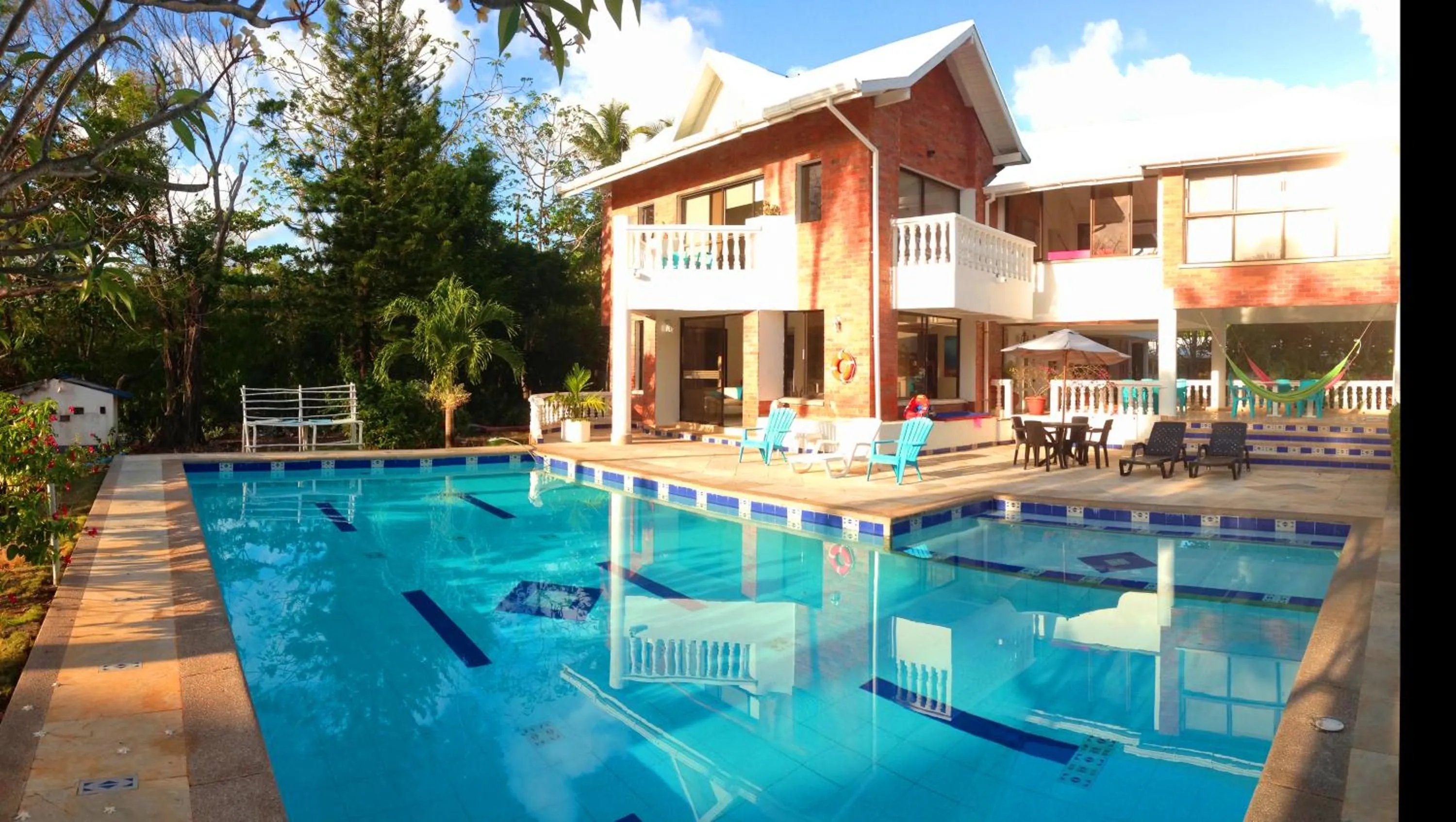 Facade/entrance in Casa de las Flores tropical