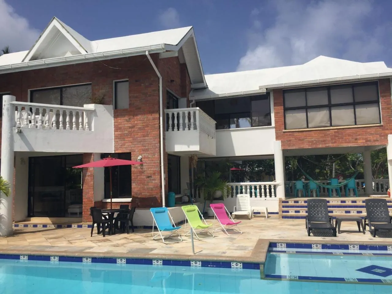 Facade/entrance in Casa de las Flores tropical