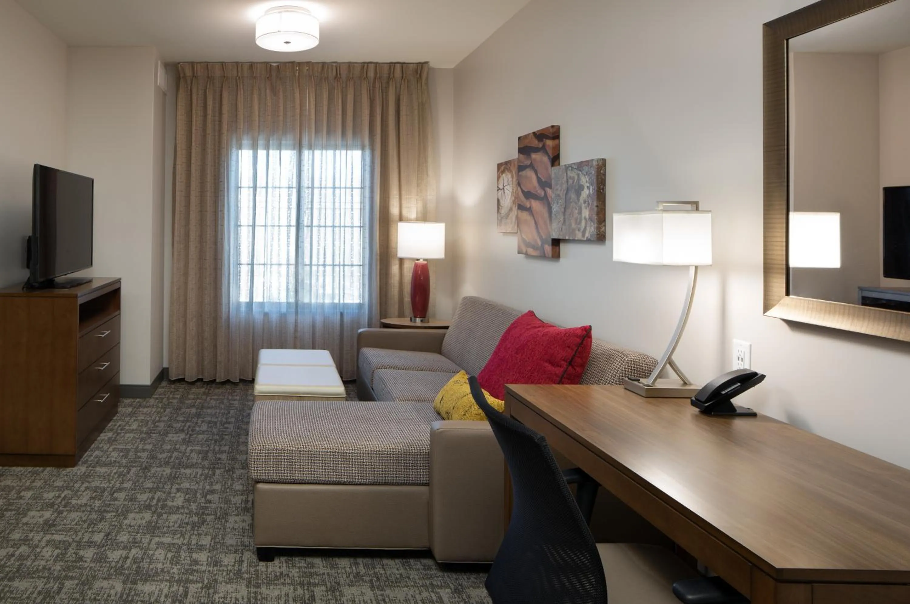 Seating area, Bed in Staybridge Suites - Phoenix – Biltmore Area by IHG