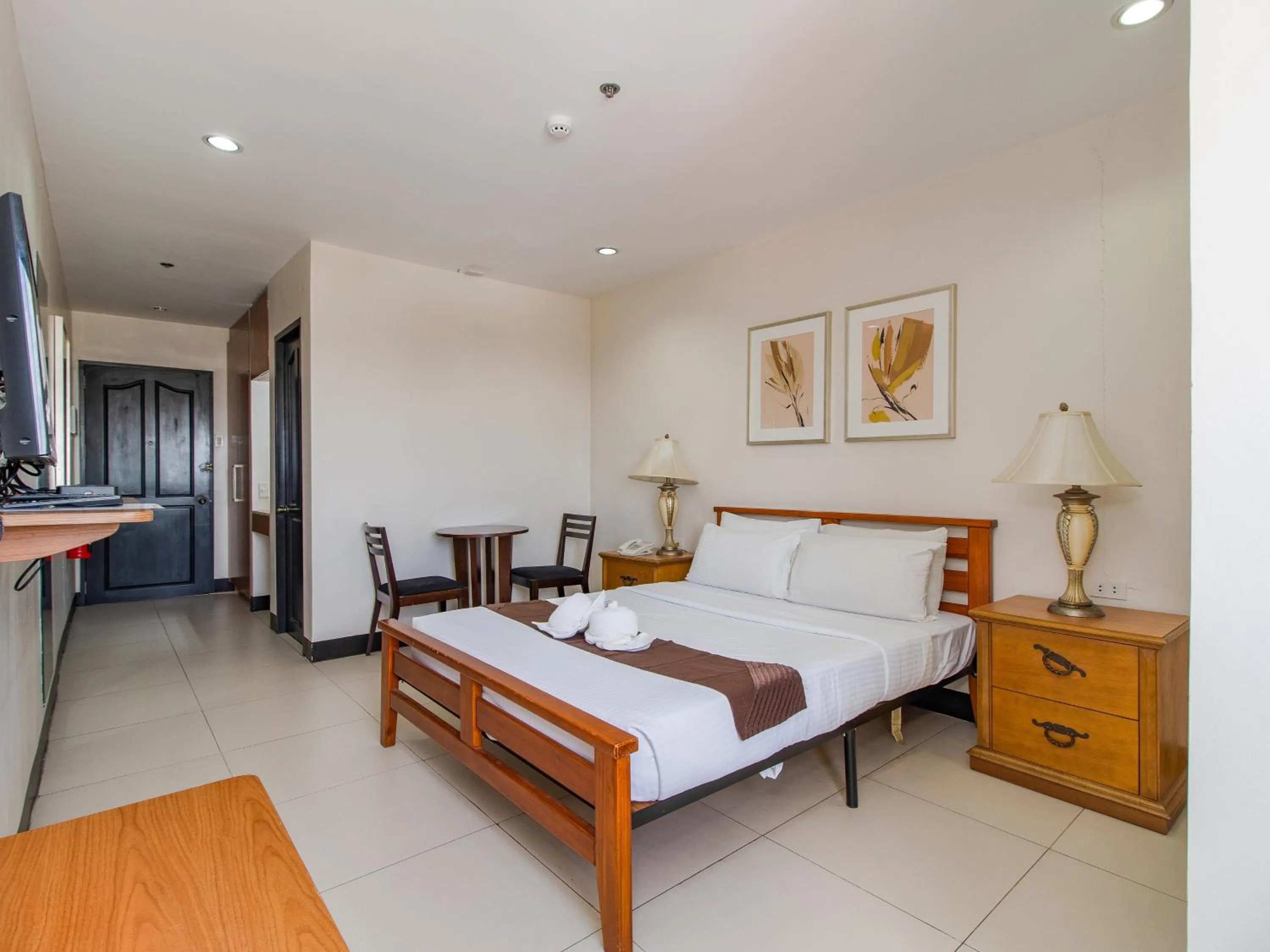 Bed in Main Hotel & Suites