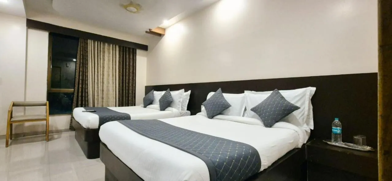 Bed in Hotel Krishna Sai Kutir