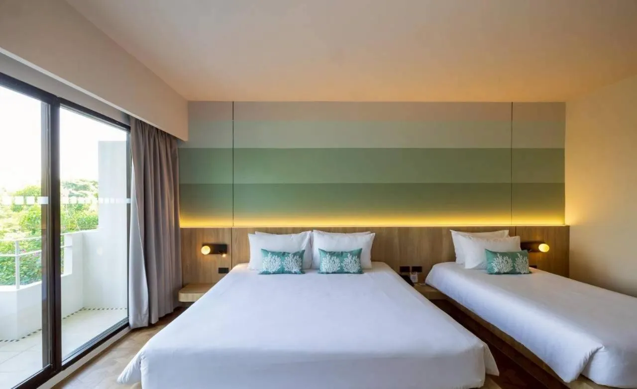 Bed in Garden Sea View Resort