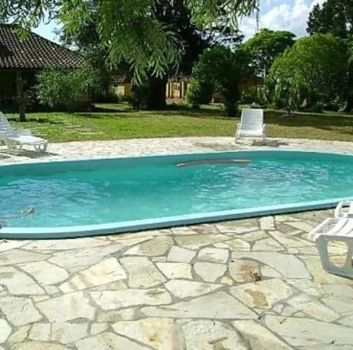 Swimming pool in Pousada Chácara das Roseiras