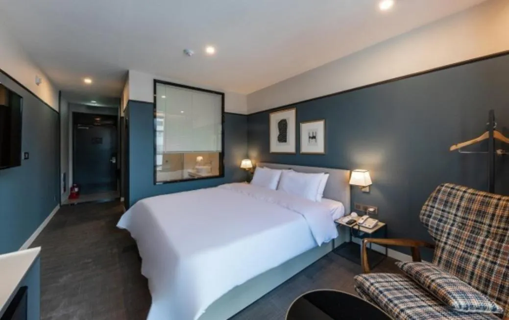 Bed in Brown Dot Hotel Deokcheon