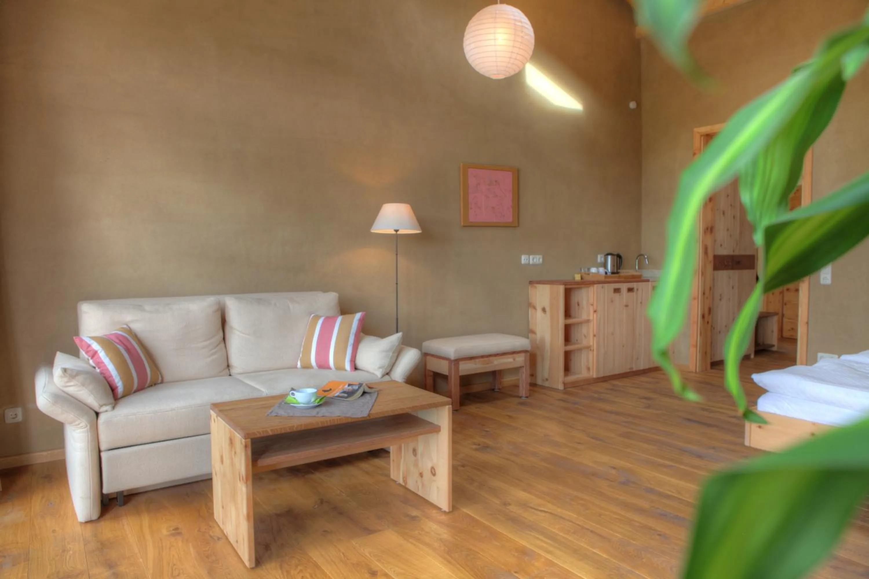 Seating area, Bed in Hotel Gutshaus Parin - Bio- und Gesundheitshotel
