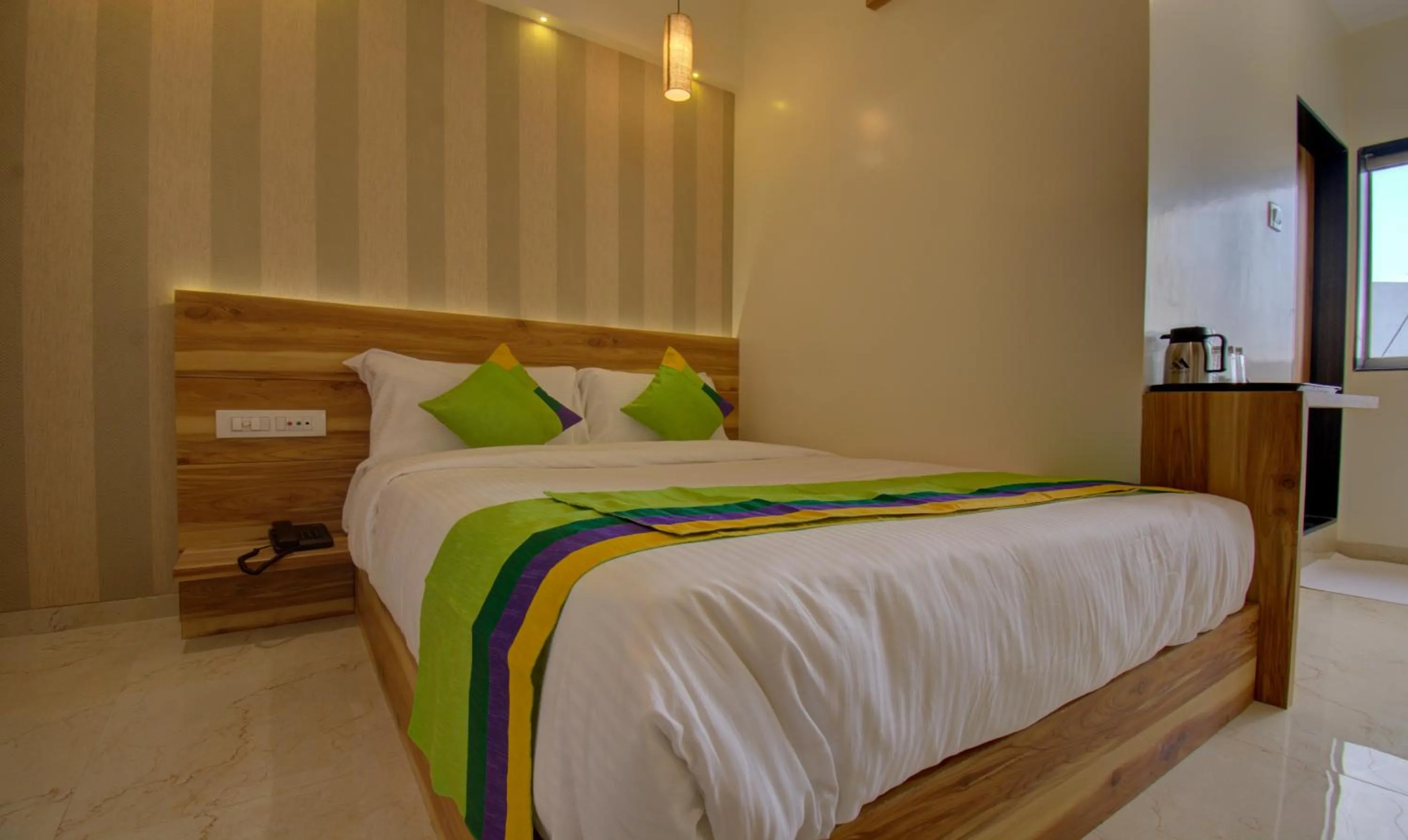 Bed in Hotel Amisha International