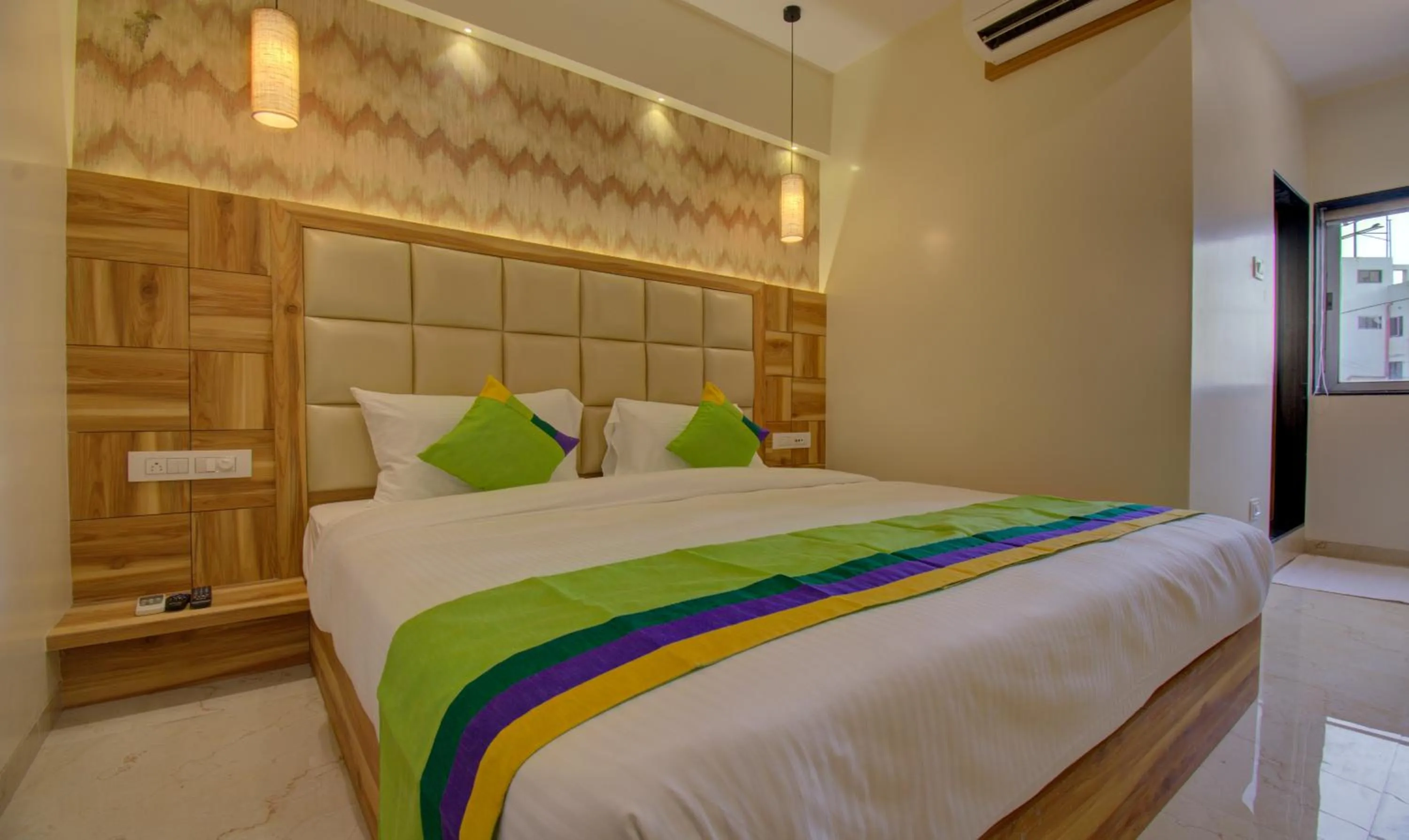 Bed in Hotel Amisha International