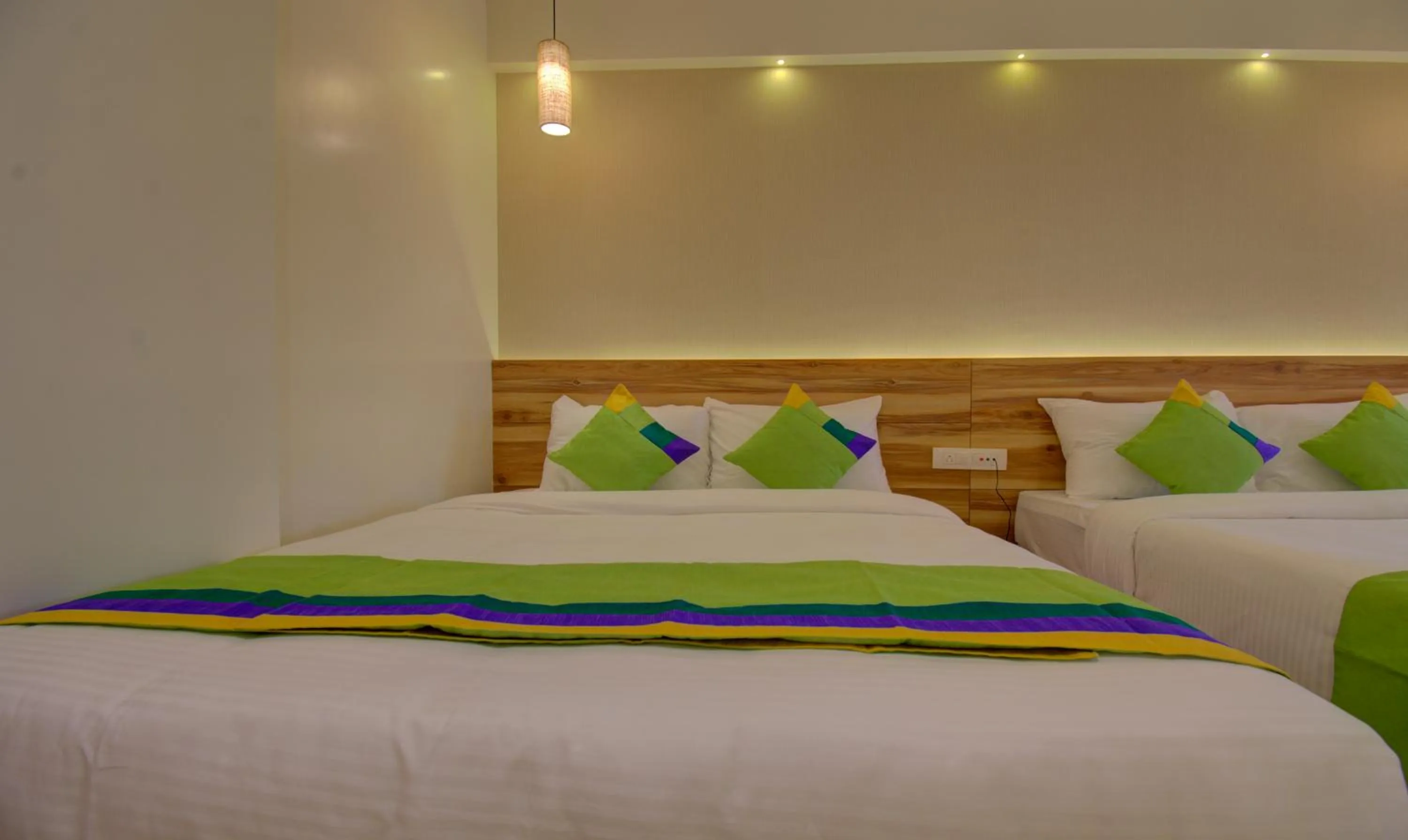 Bed in Hotel Amisha International