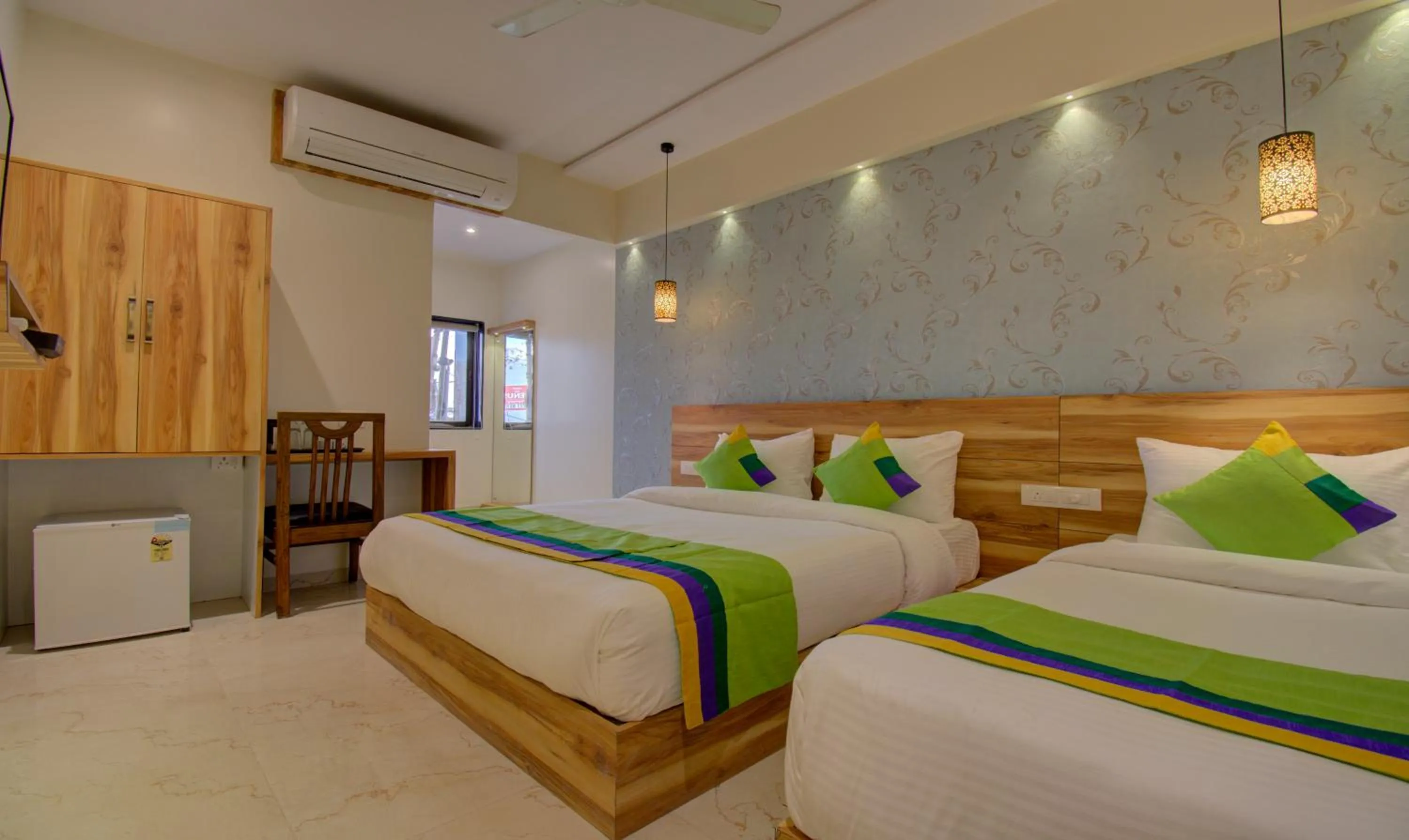 Bed in Hotel Amisha International