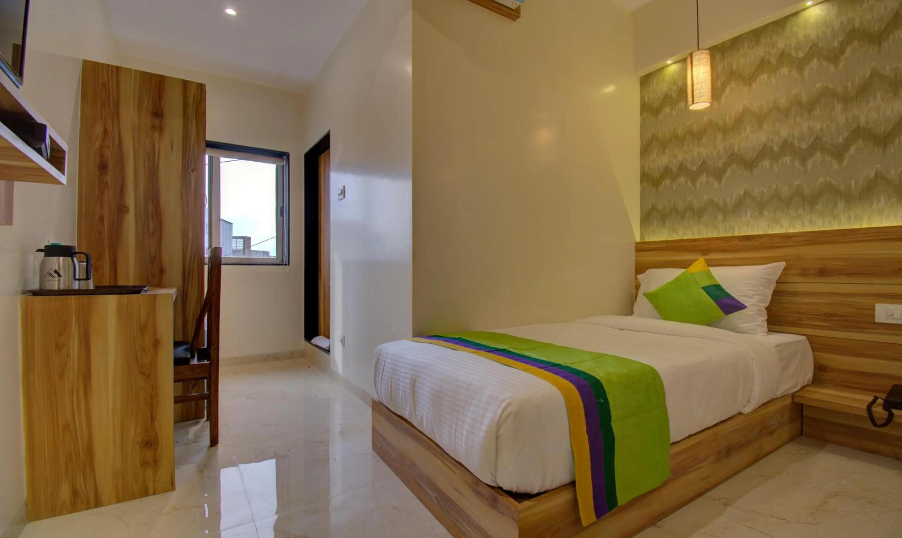 Bed in Hotel Amisha International