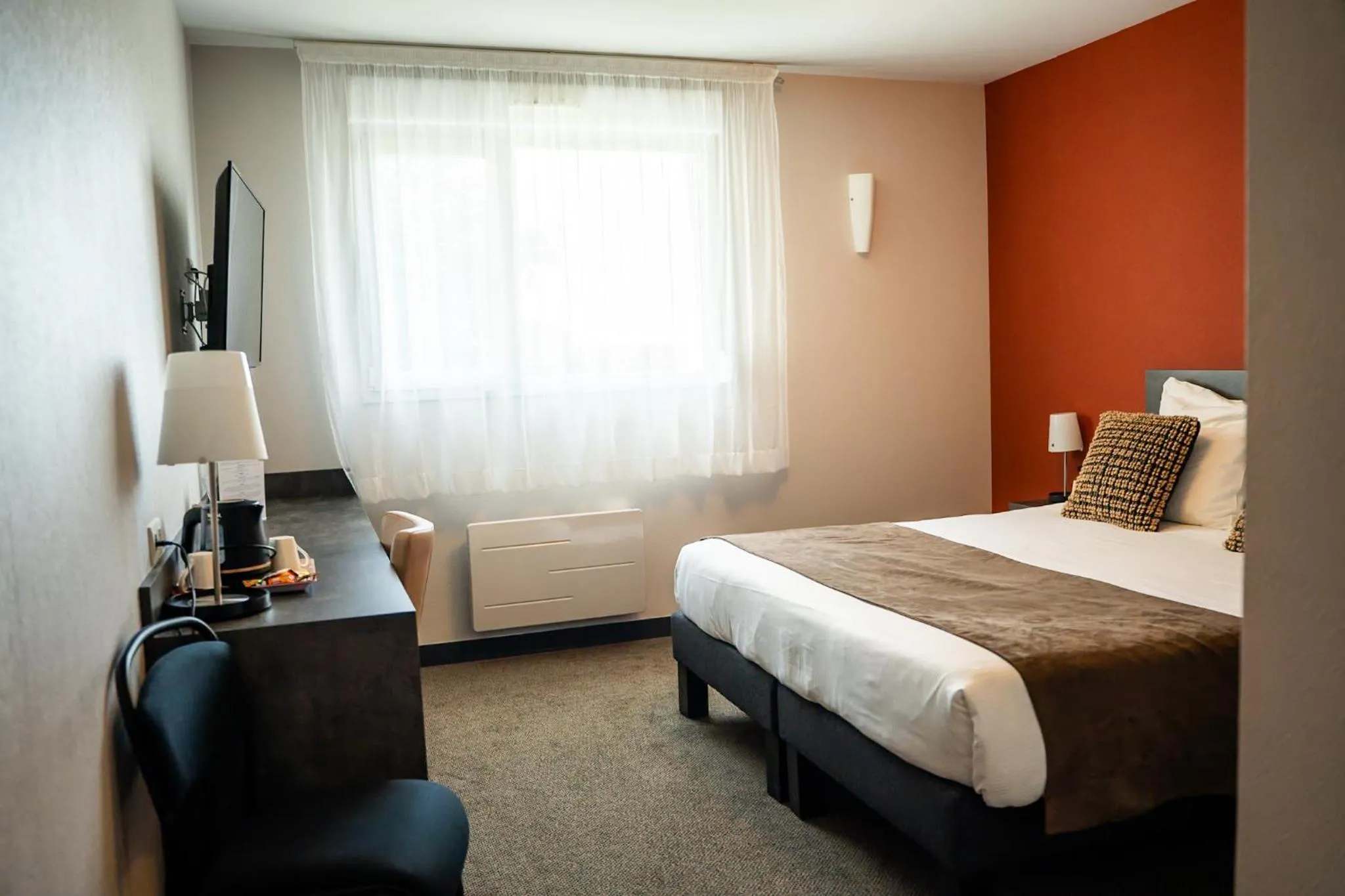 Bed in LOGIS Hôtel ARCADIA