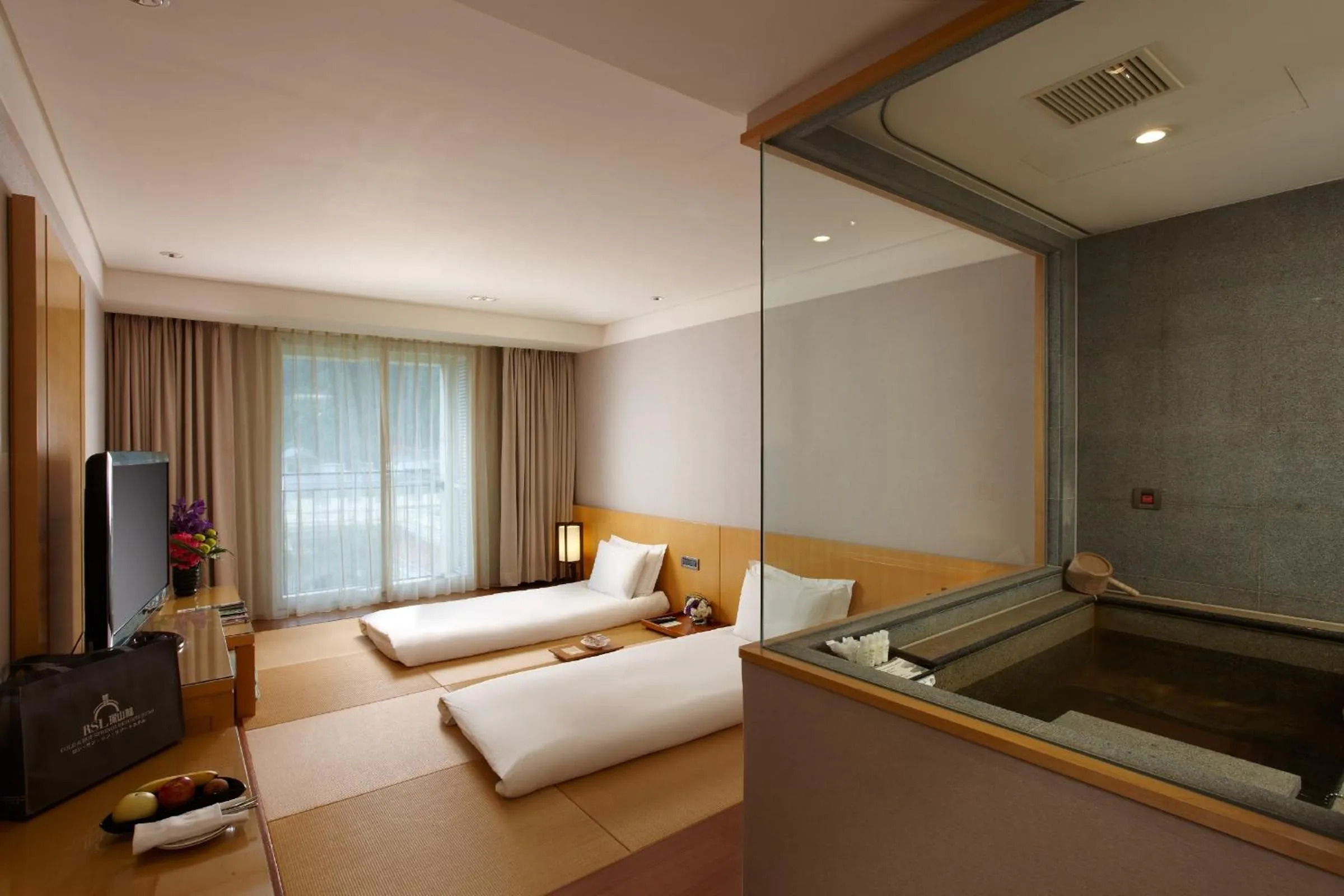 Photo of the whole room, Bed in RSL Cold & Hot Springs Resort Suao