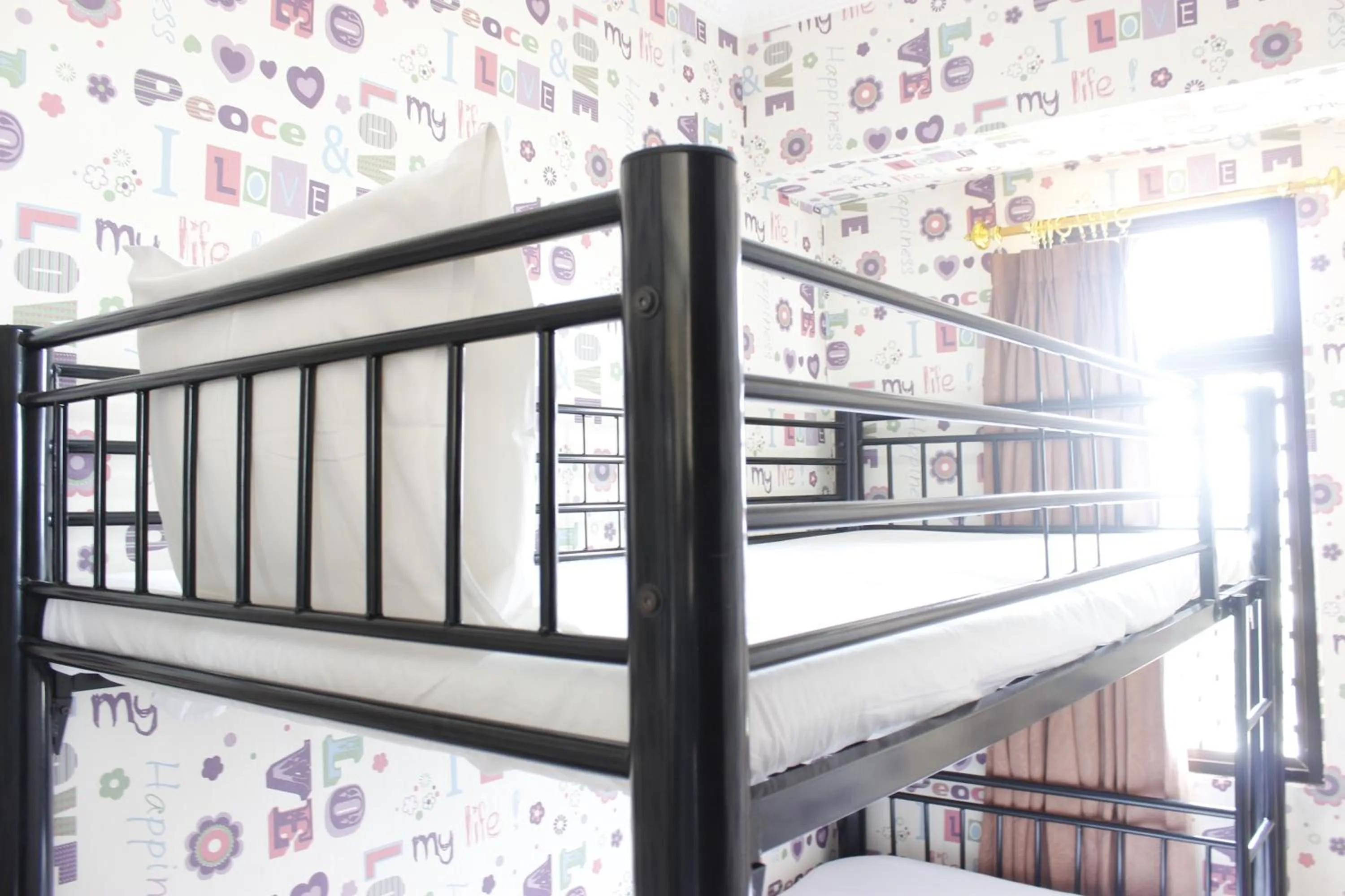 Bed in Cozy 2BR Tamansari Panoramic Apartment By Travelio