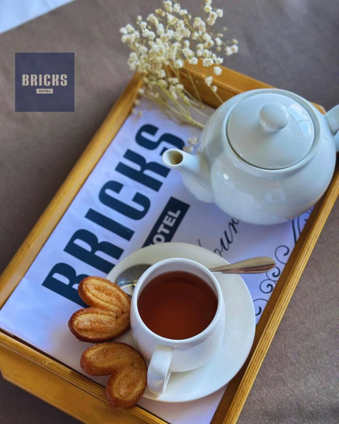 Property logo or sign in Bricks Hotel