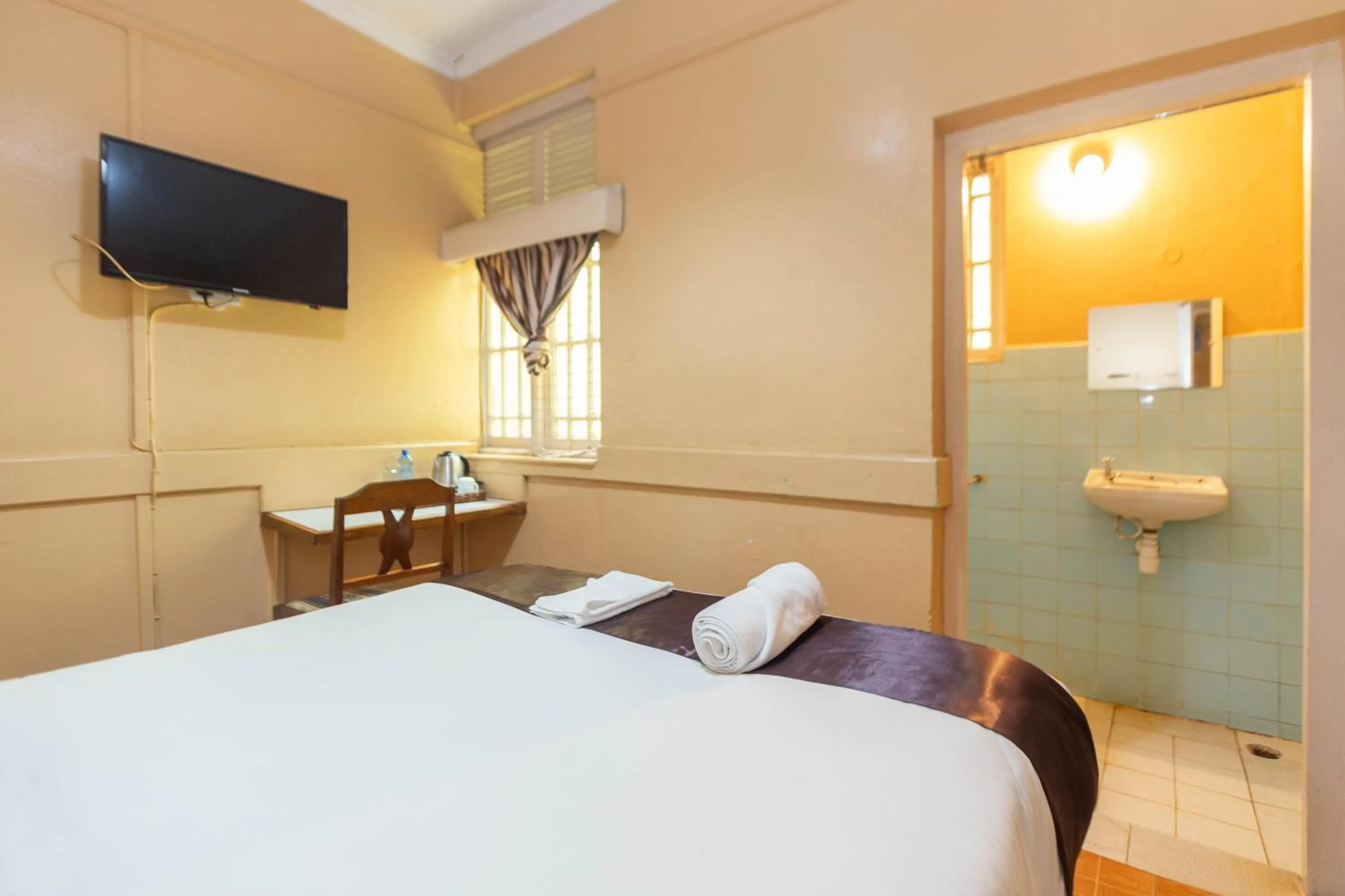 Bed in Impala Hotel Parklands