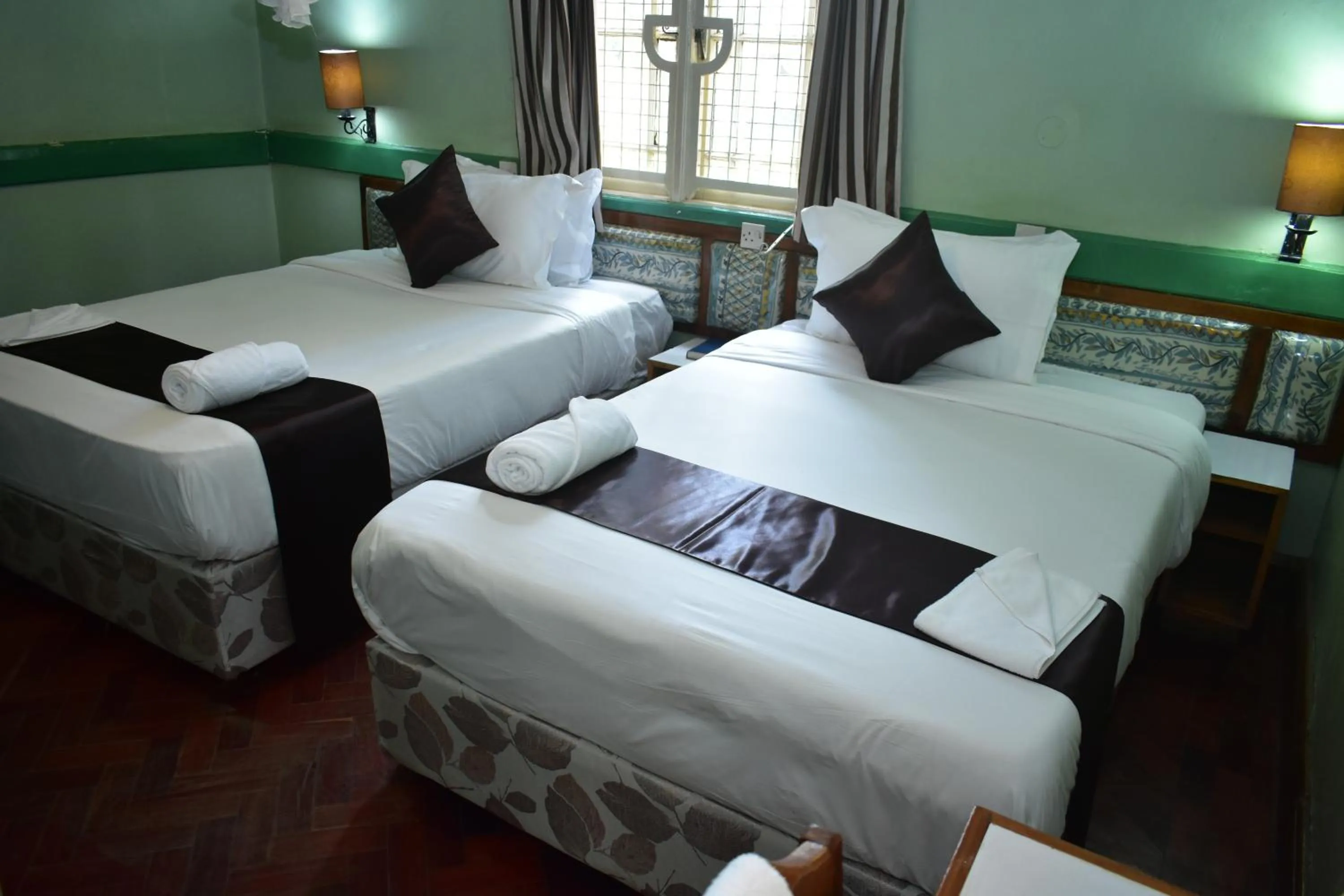 Bed in Impala Hotel Parklands