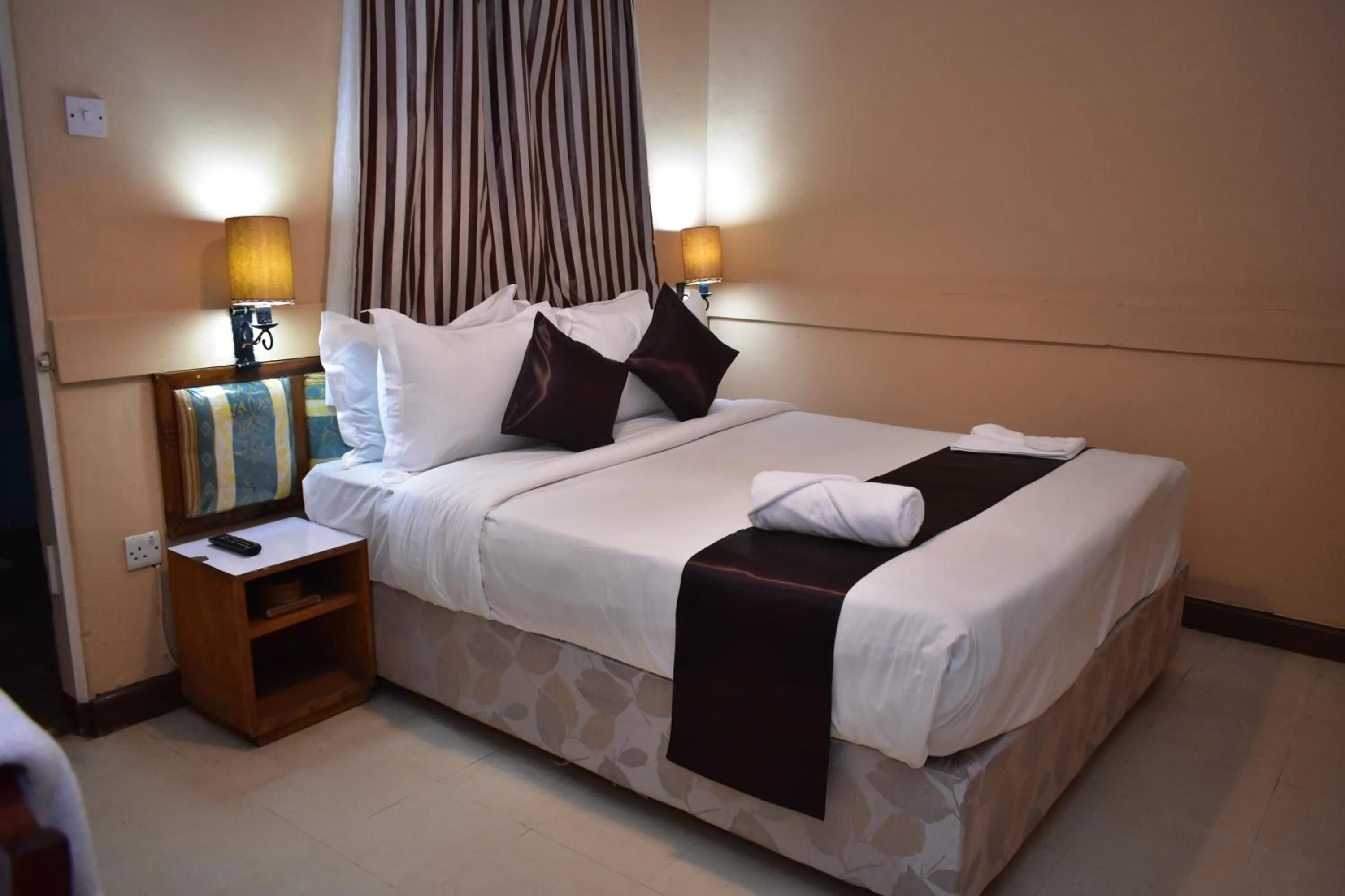 Bed in Impala Hotel Parklands