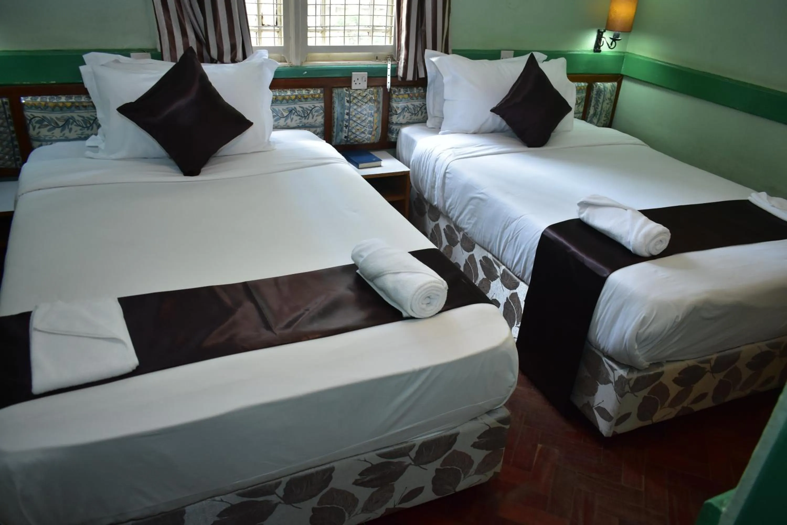 Bed in Impala Hotel Parklands