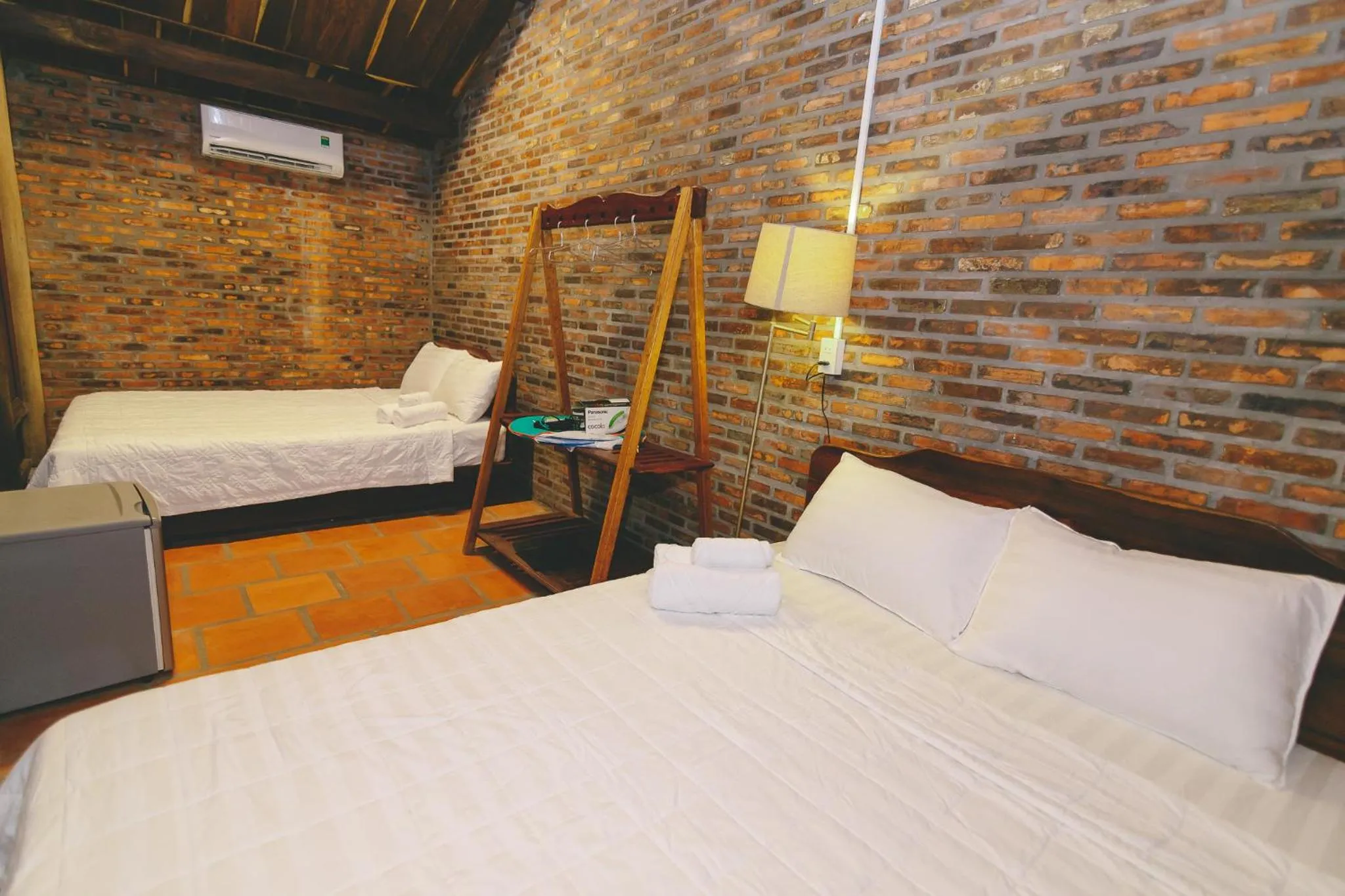 Bed in CASA ECO Mekong Resort