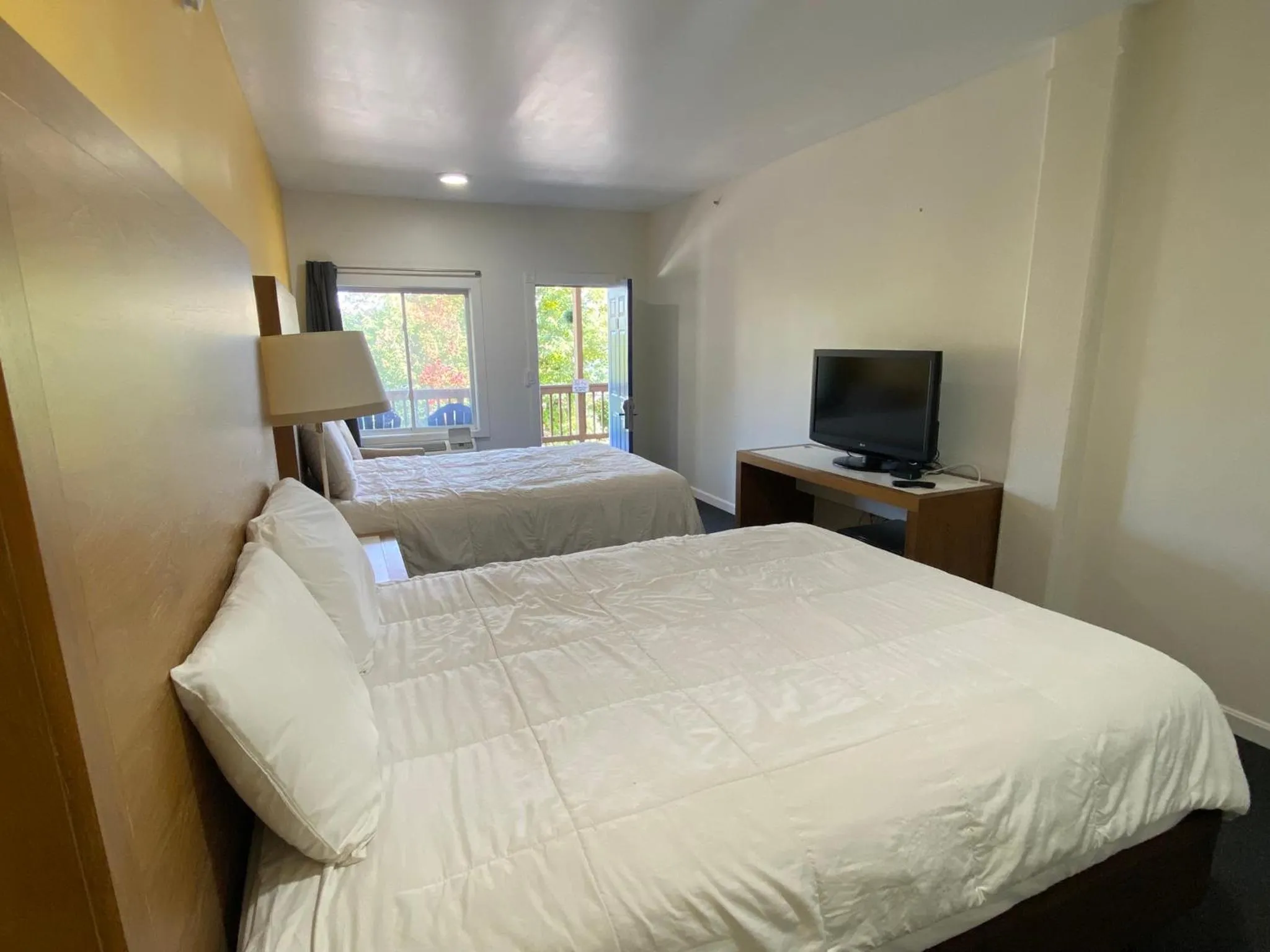 Bed in Winnisquam Lake Inn