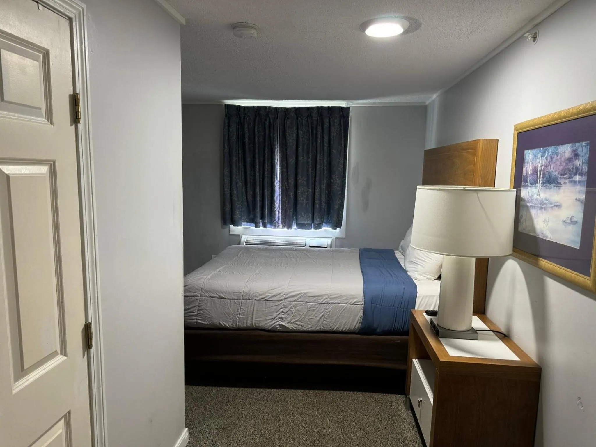 Bed in Winnisquam Lake Inn