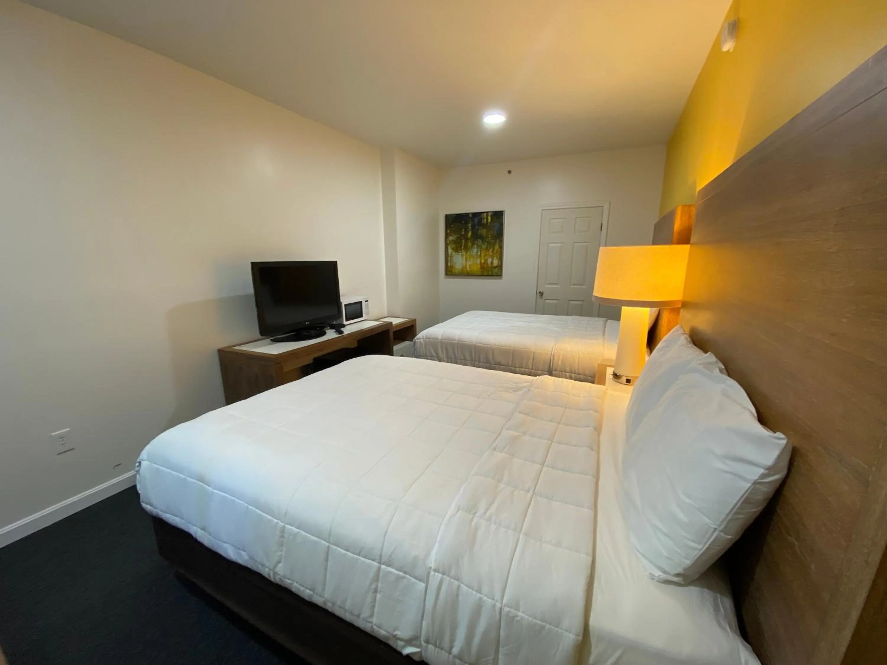 Bed in Winnisquam Lake Inn