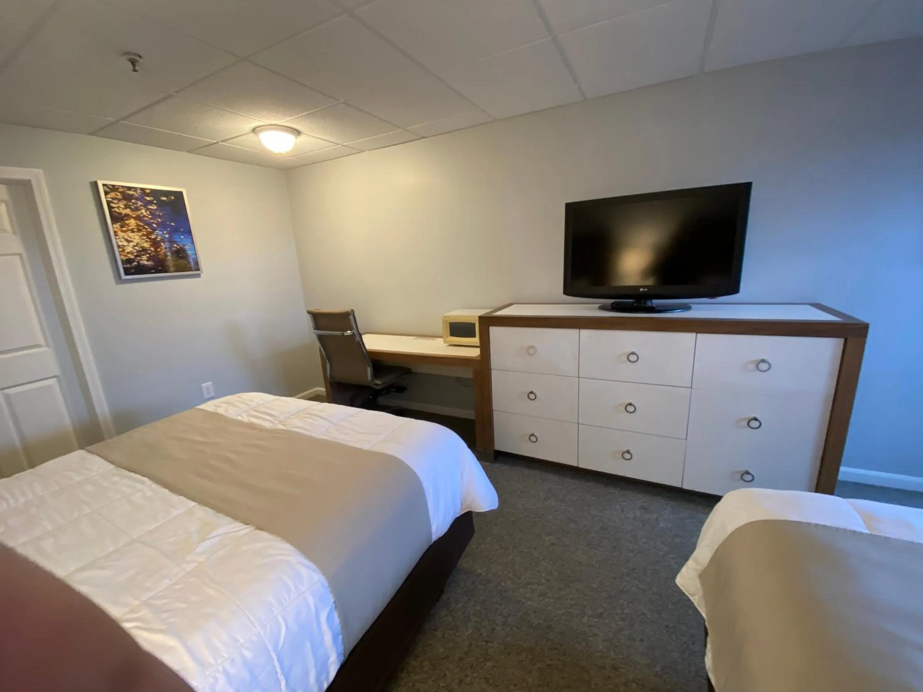 Bed in Winnisquam Lake Inn