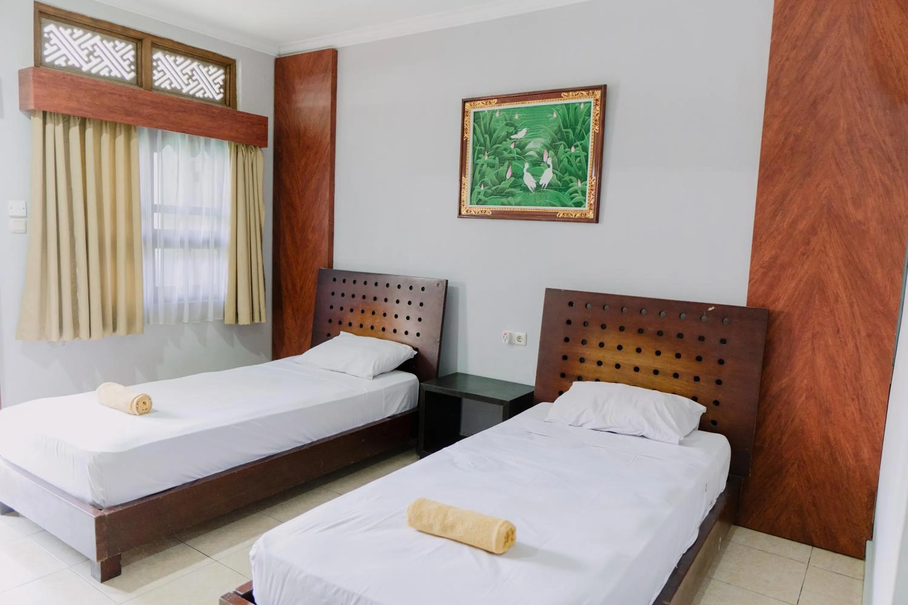 Bed in Gemini Star Hotel Kuta