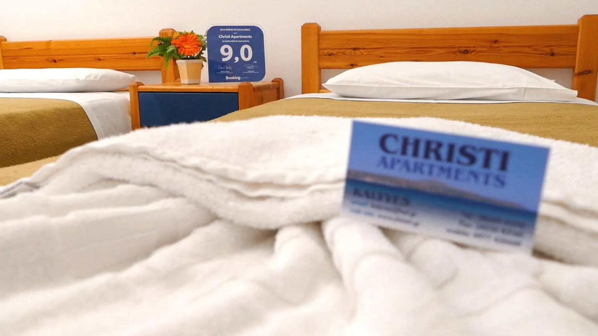 Property logo or sign, Bed in Christi Apartments