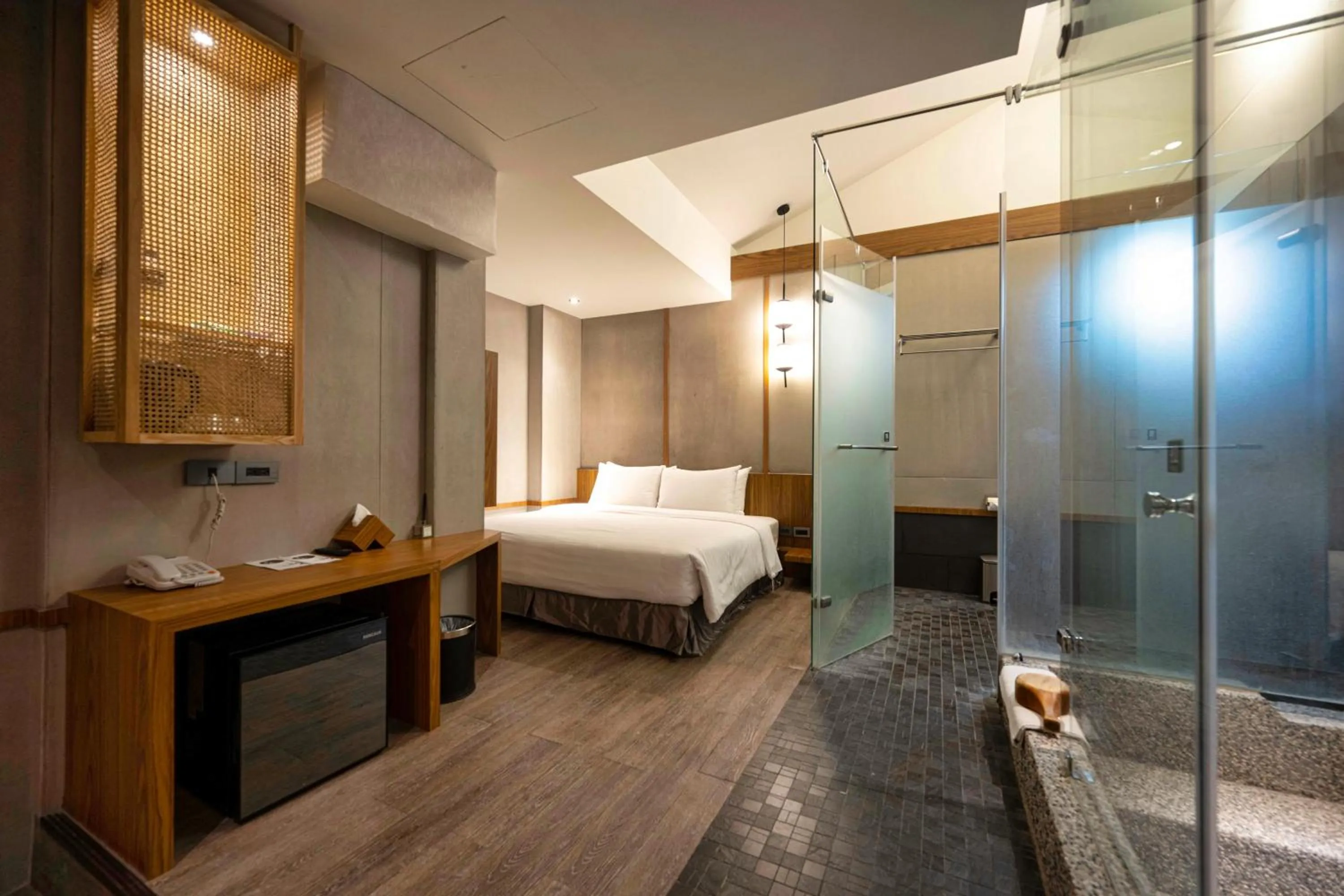 Bed in Yunoyado Onsen Hot Spring Hotel Deyang