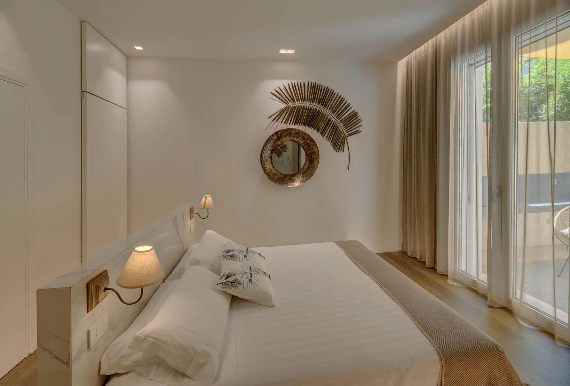 Bed in Le Palmette Suites