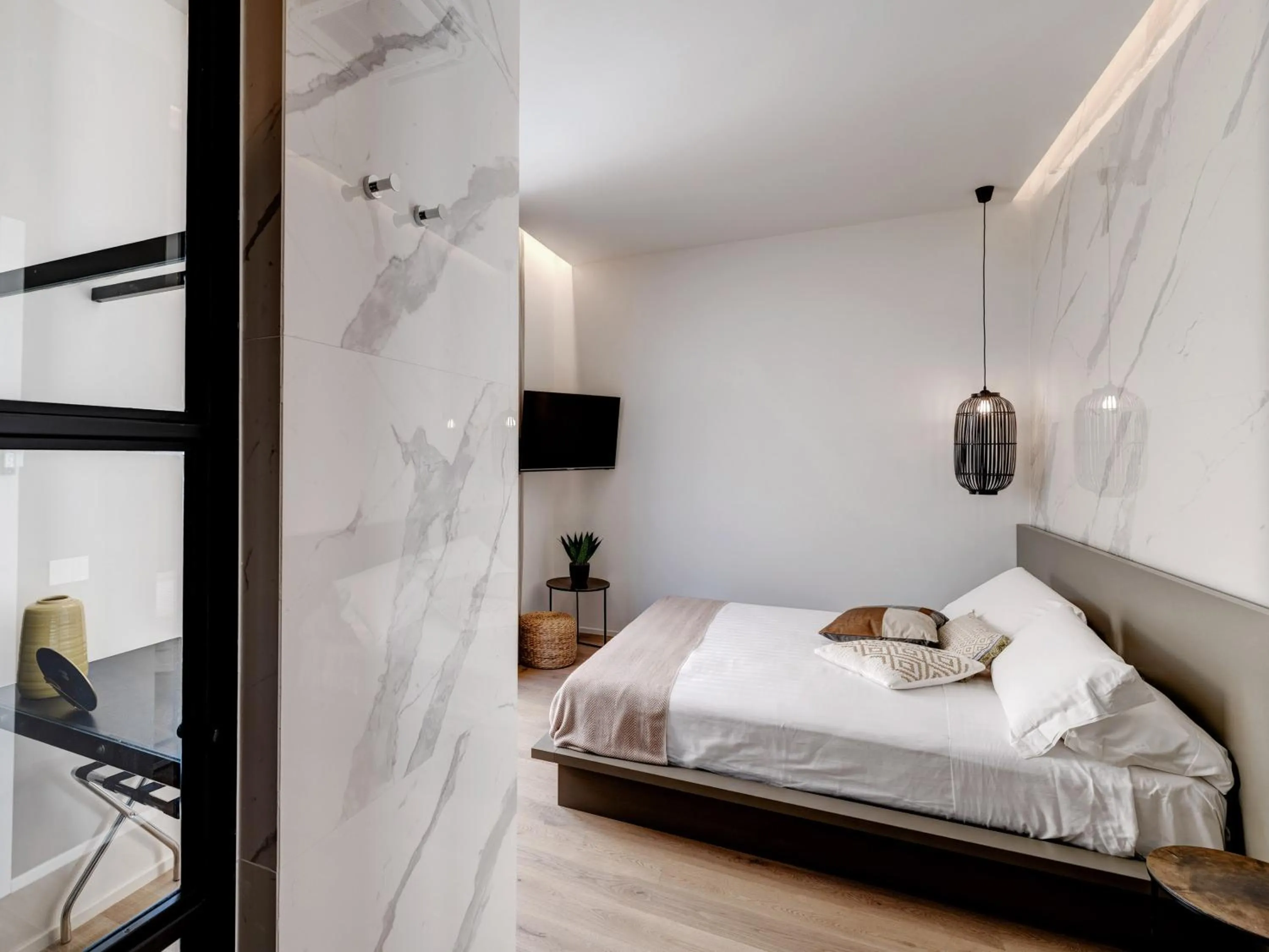 Bed in Le Palmette Suites