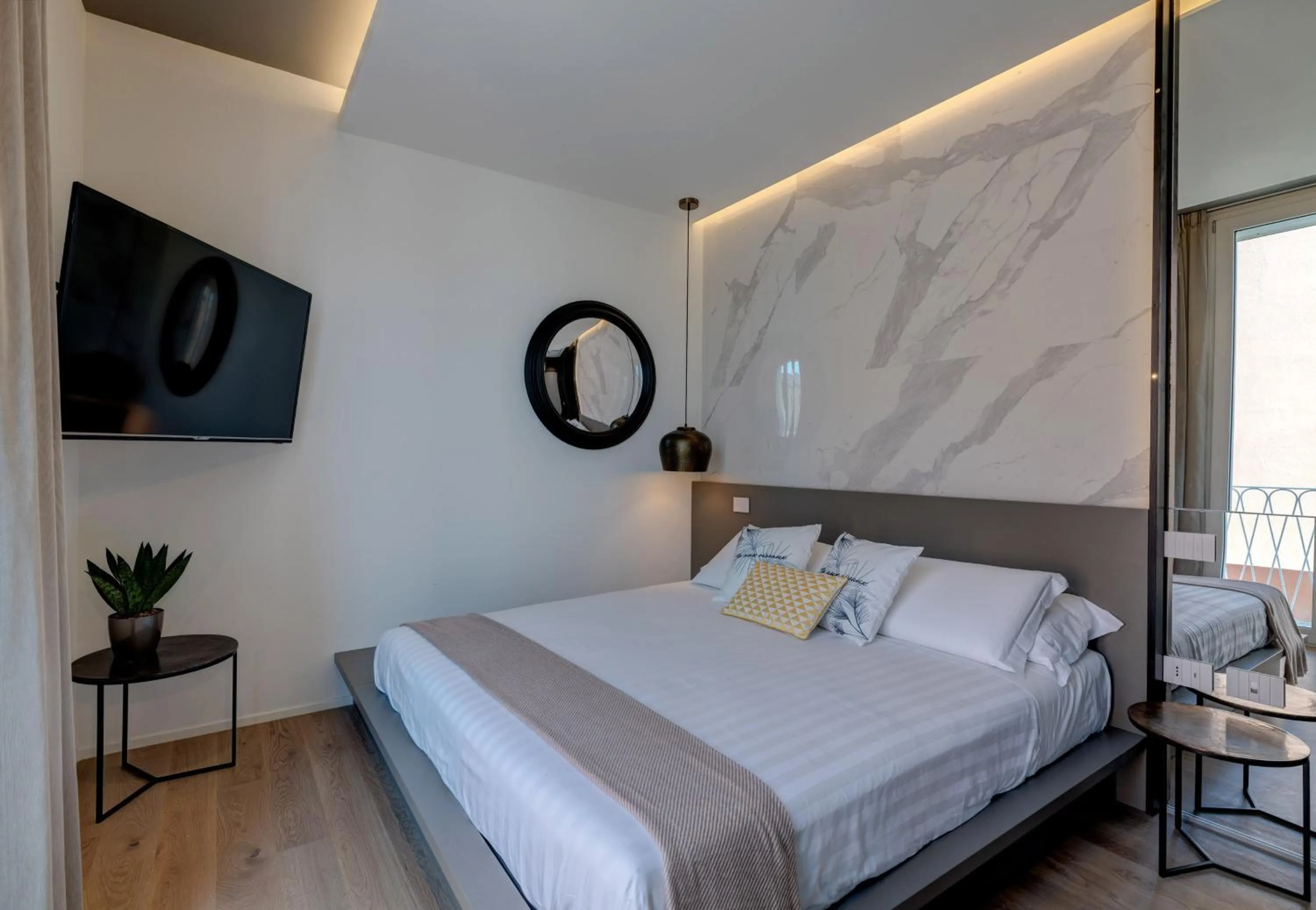 Bed in Le Palmette Suites