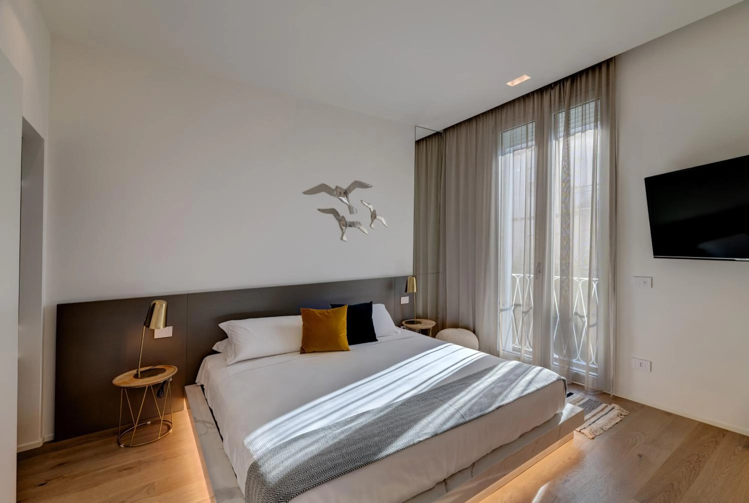 Bed in Le Palmette Suites