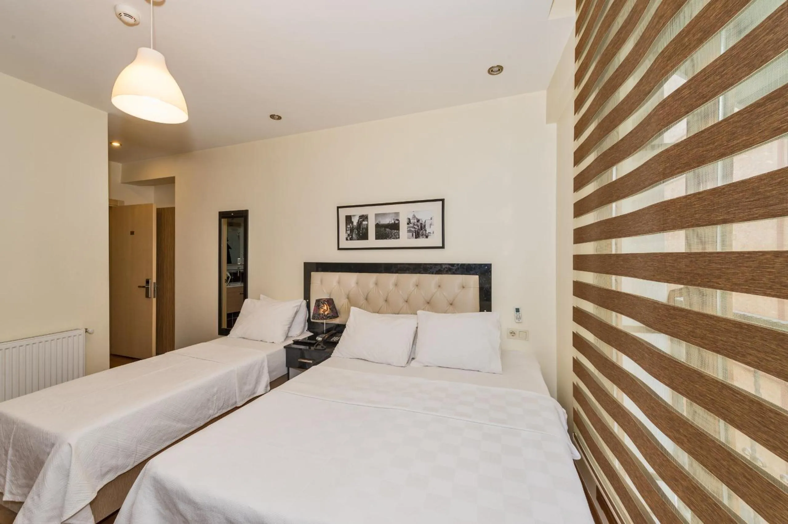 Bed in Invictum Residence