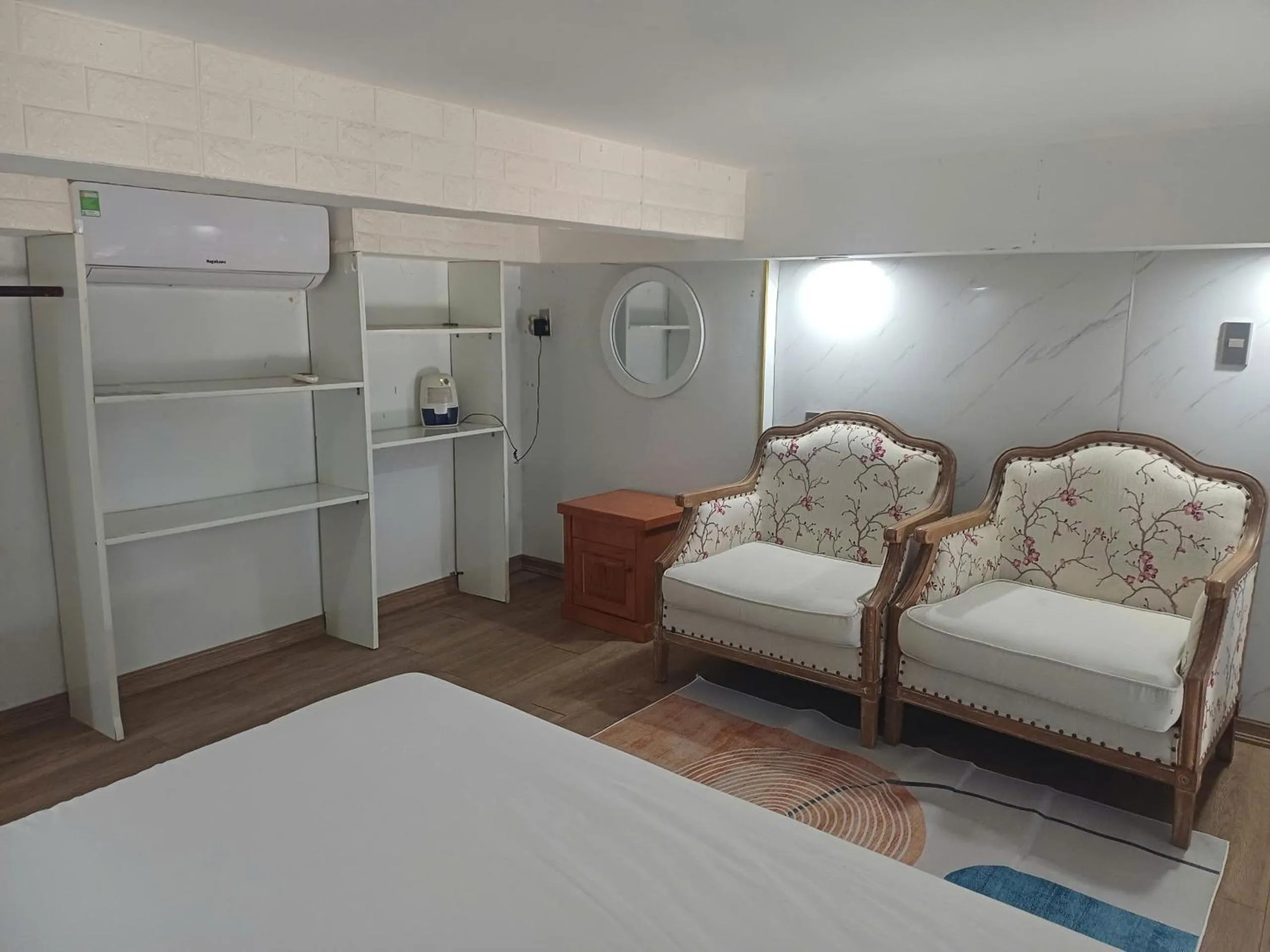 Seating area, Bed in Seashine Apartment