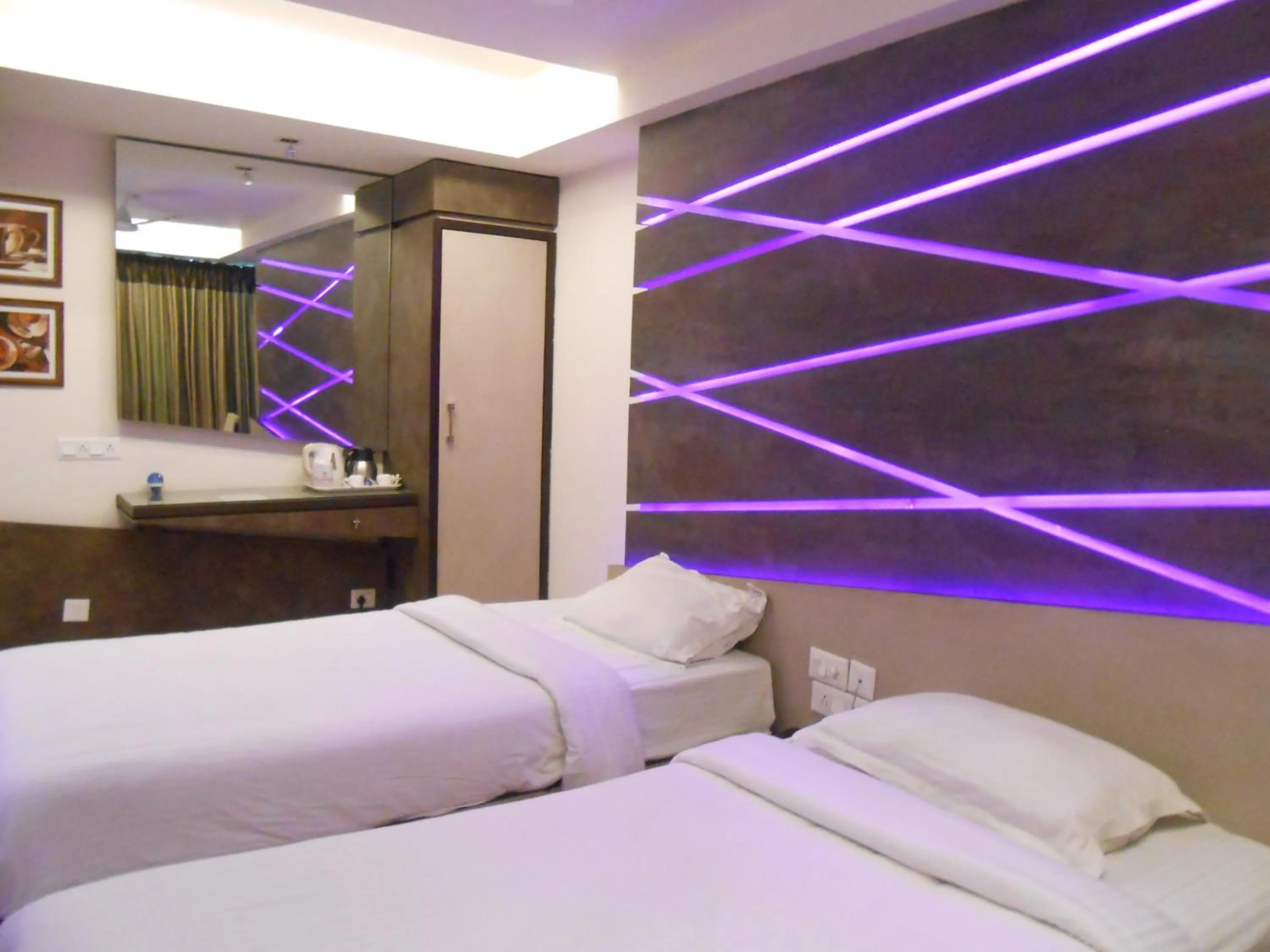 Bed in Hotel Aston International