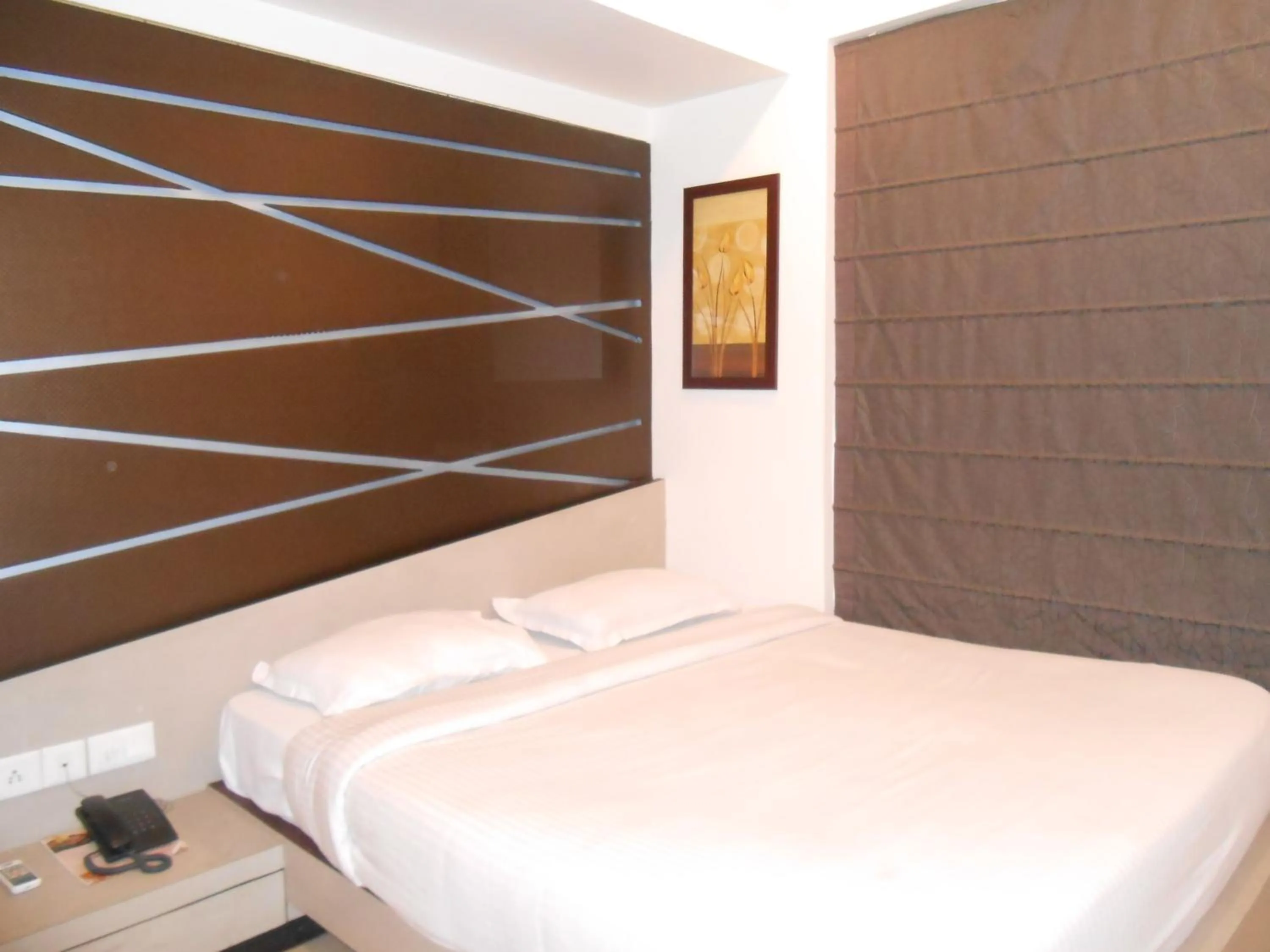 Bed in Hotel Aston International