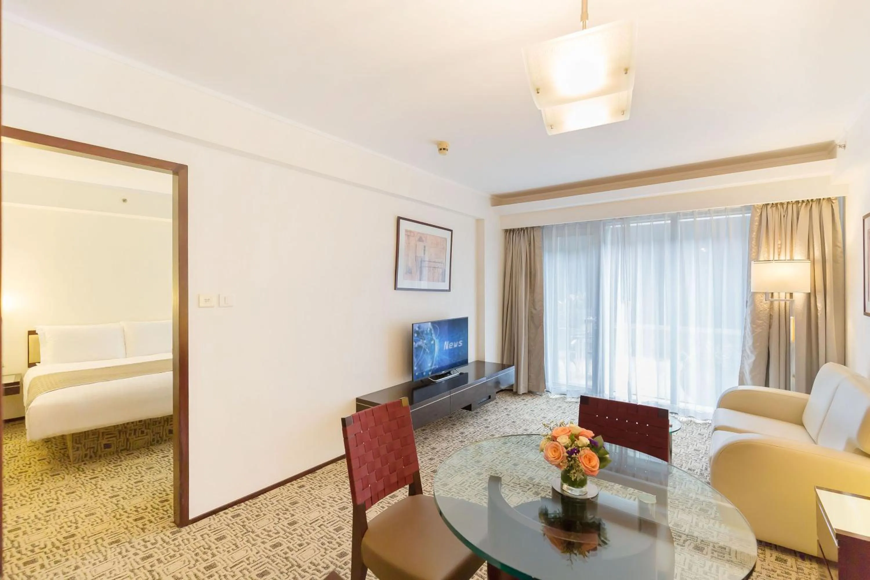 Living room, Bed in Regal Airport Hotel