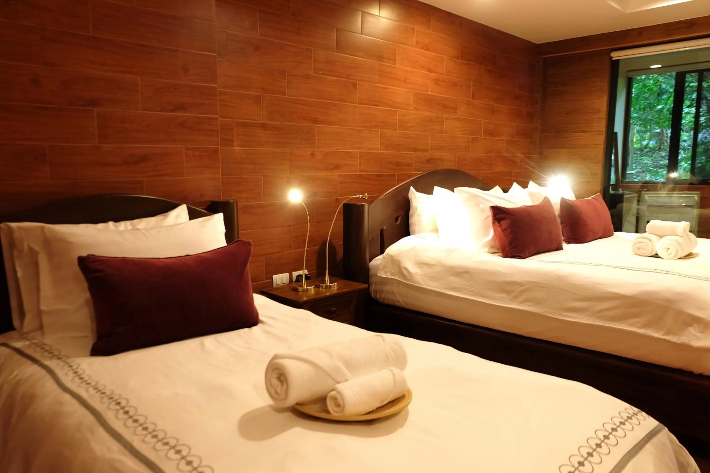 Bed in Namtok Sarika Resotel