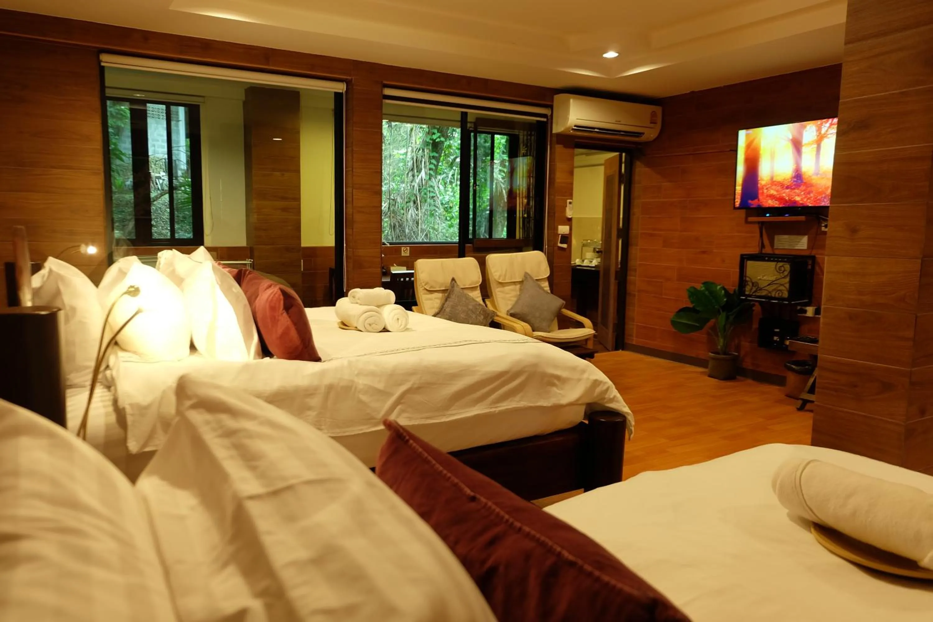 Bed in Namtok Sarika Resotel