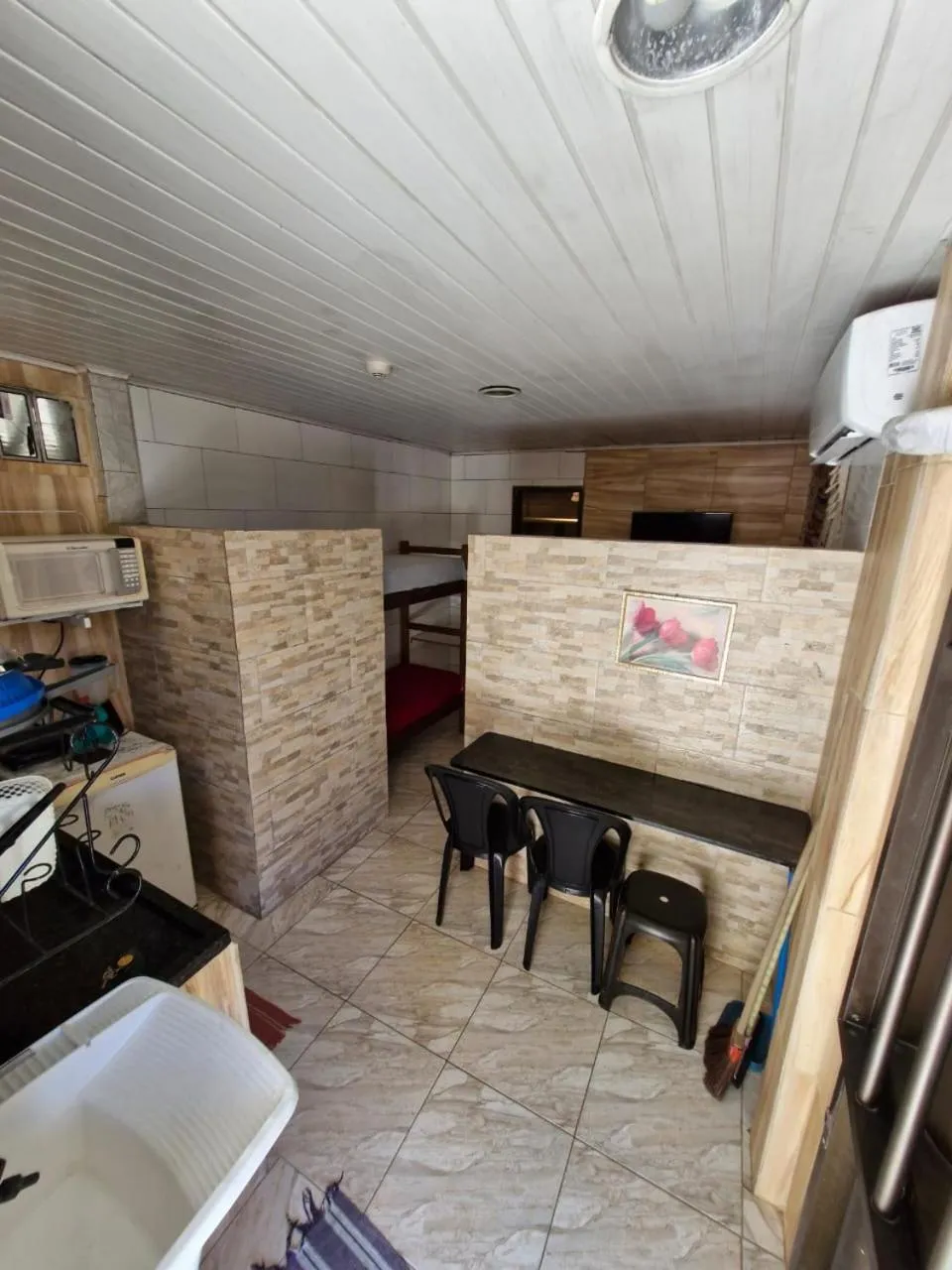 Kitchen or kitchenette in Kitnets com AR Condicionado na Praia